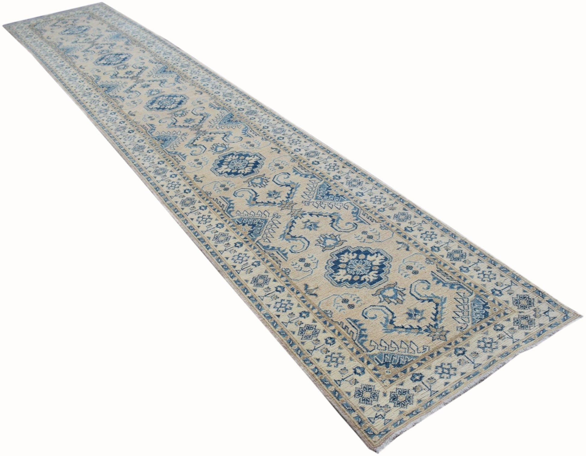 A handmade Afghan Kazakh runner rug featuring a traditional blue and beige geometric pattern.