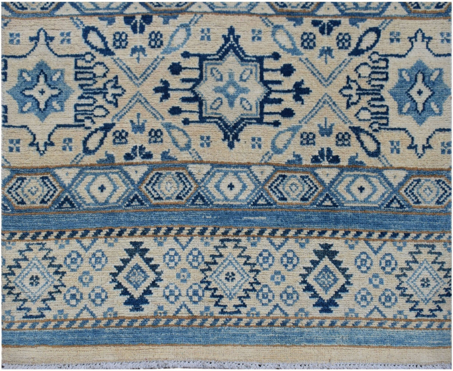 Handmade Afghan Kazakh runner rug featuring geometric blue and beige tribal patterns.