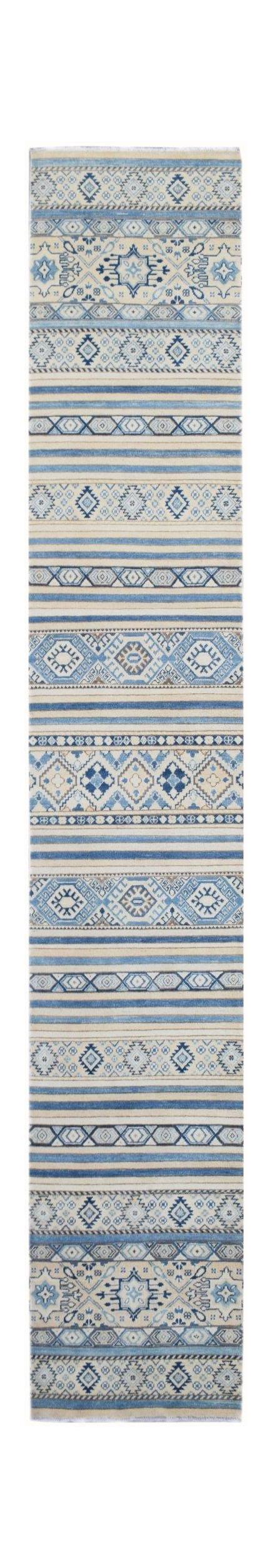 A handmade Afghan Kazakh runner rug featuring a geometric pattern in shades of blue and beige.