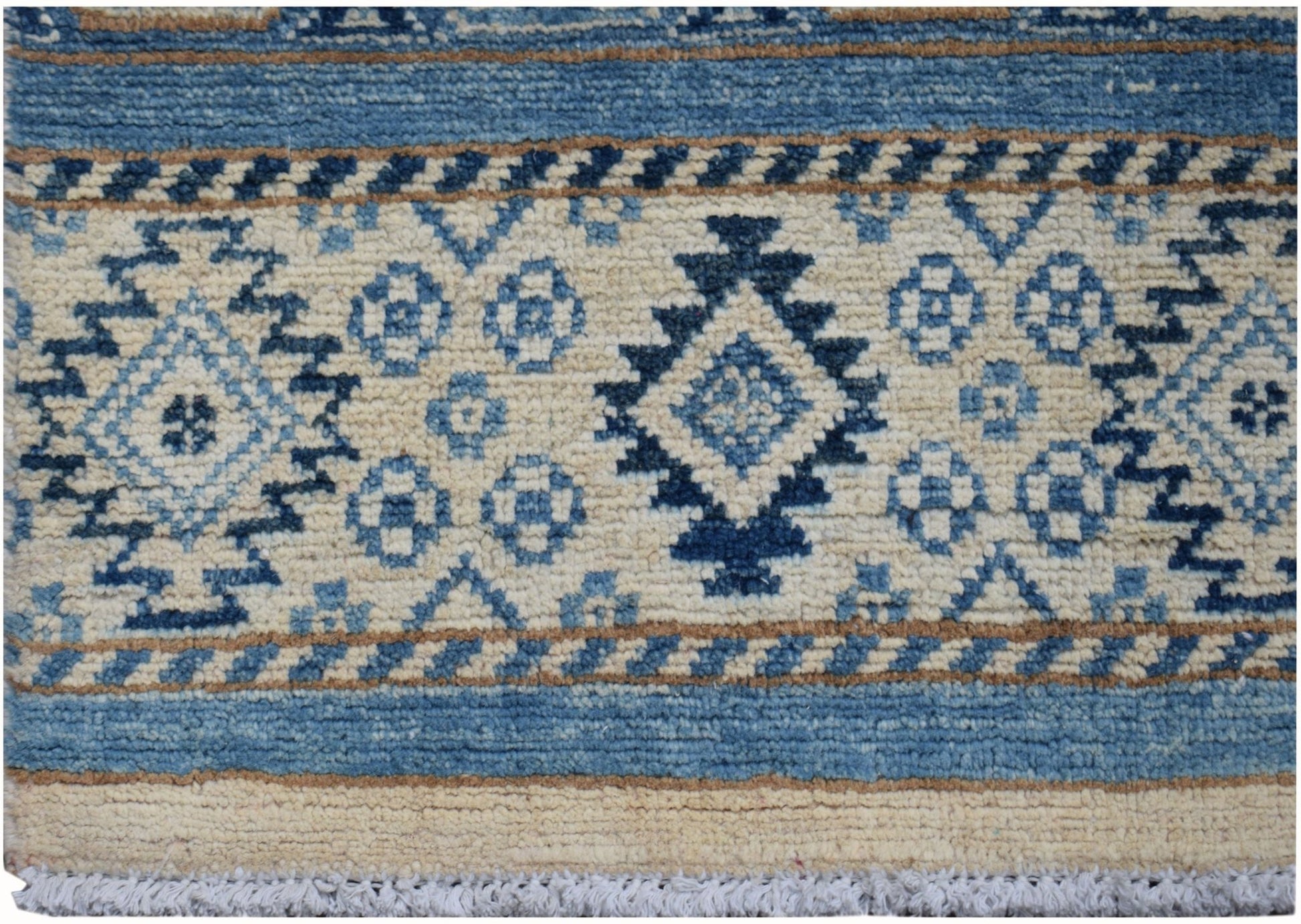 Handmade Afghan Kazakh runner rug featuring geometric blue and beige tribal patterns.