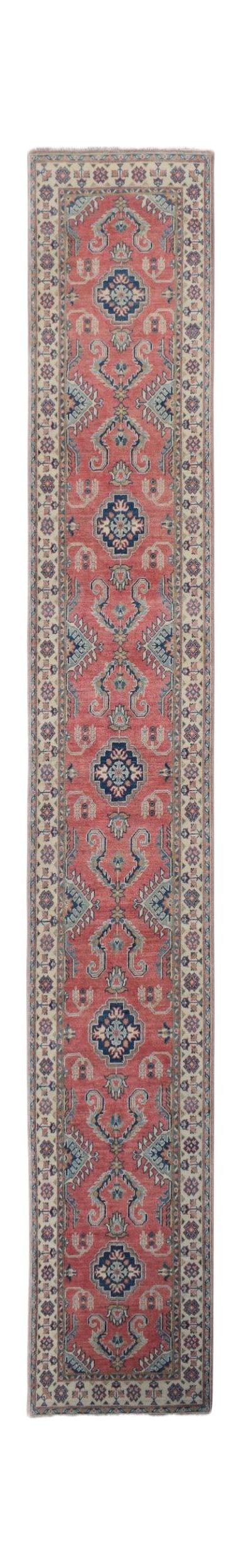 A handmade Afghan Kazakh runner rug featuring traditional geometric motifs in red and blue.