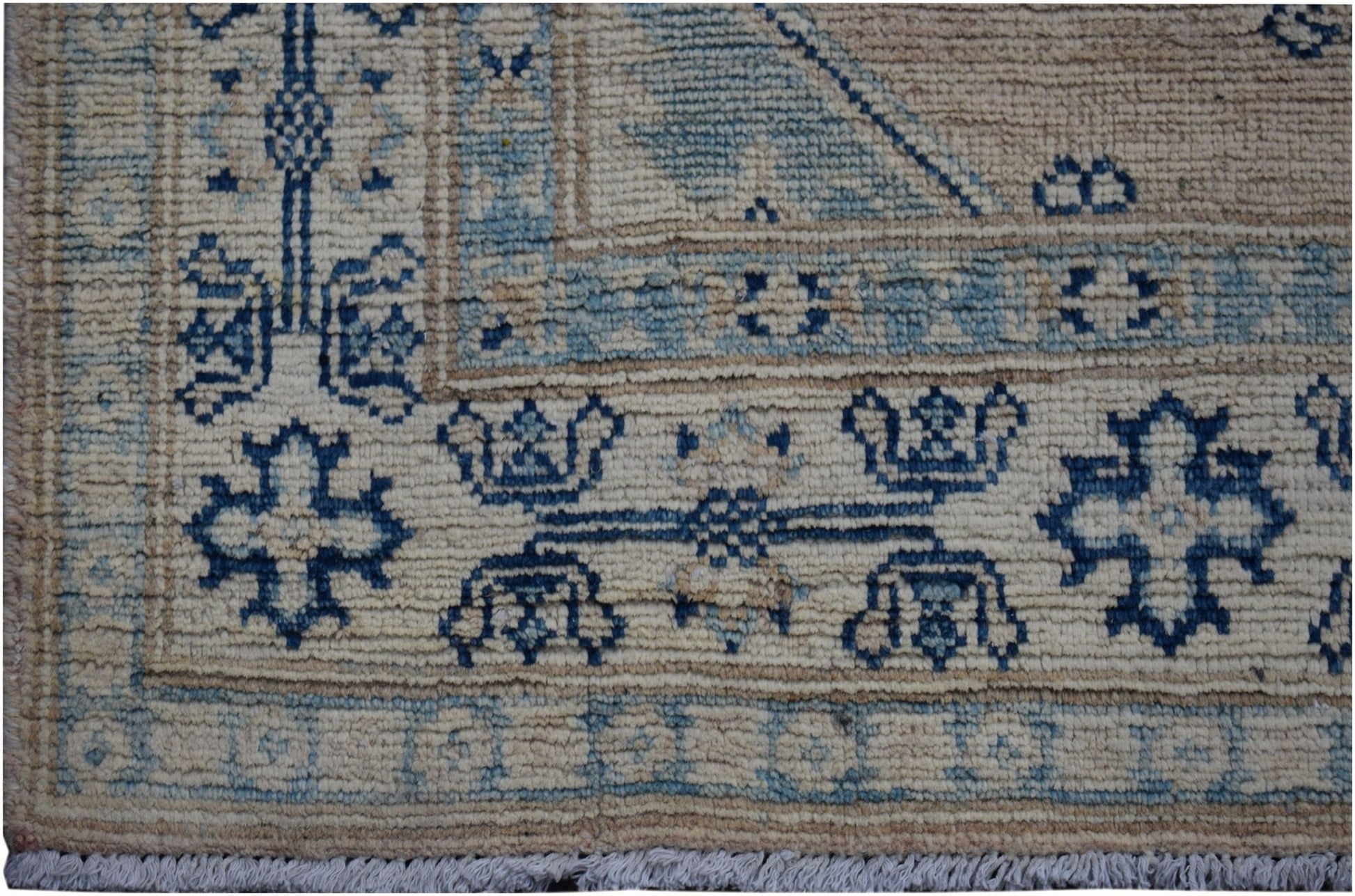 Handmade Afghan Kazakh runner featuring a geometric blue and beige wool pattern.