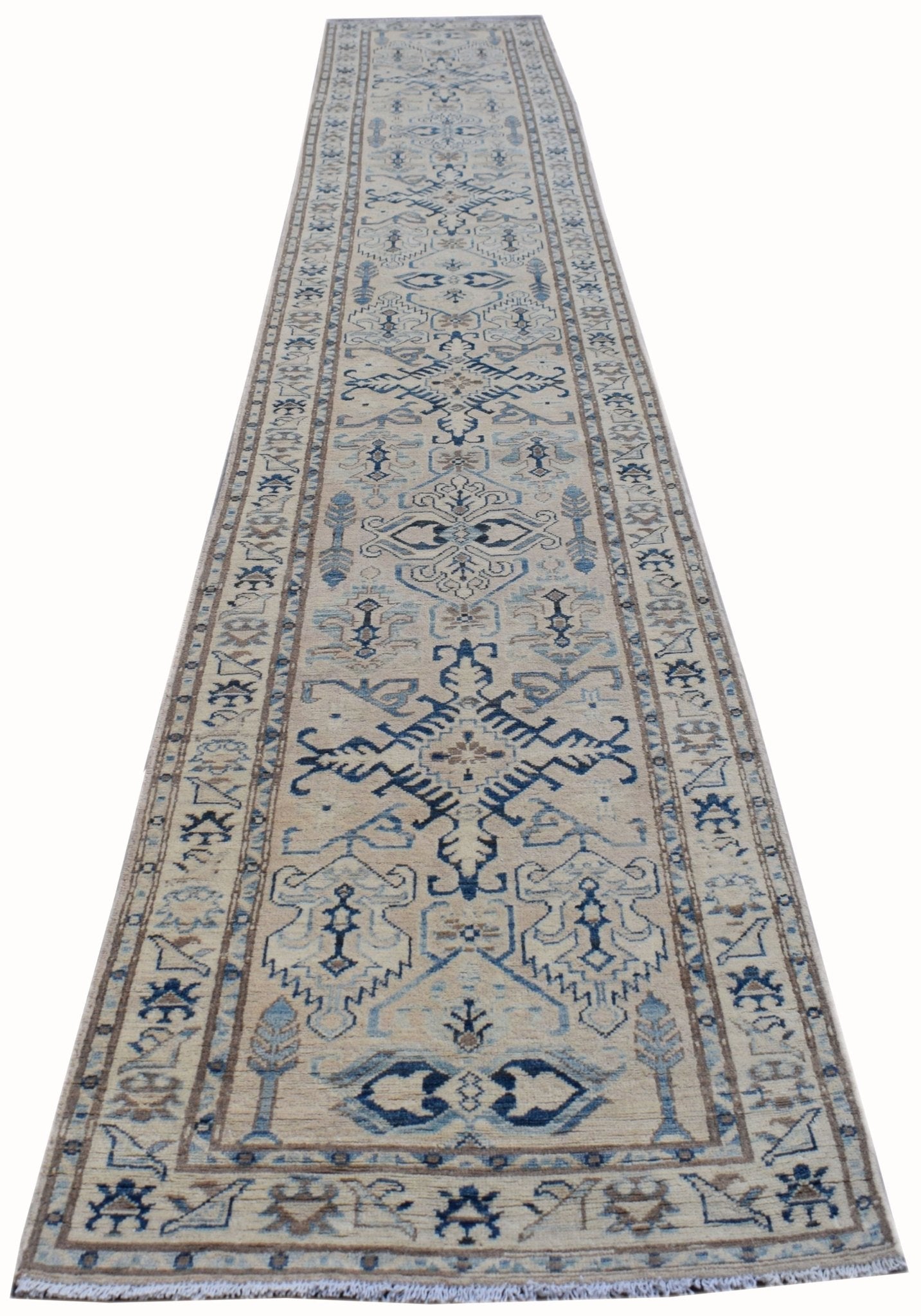 Handmade Afghan Kazakh runner rug featuring a traditional geometric pattern in shades of blue and beige.