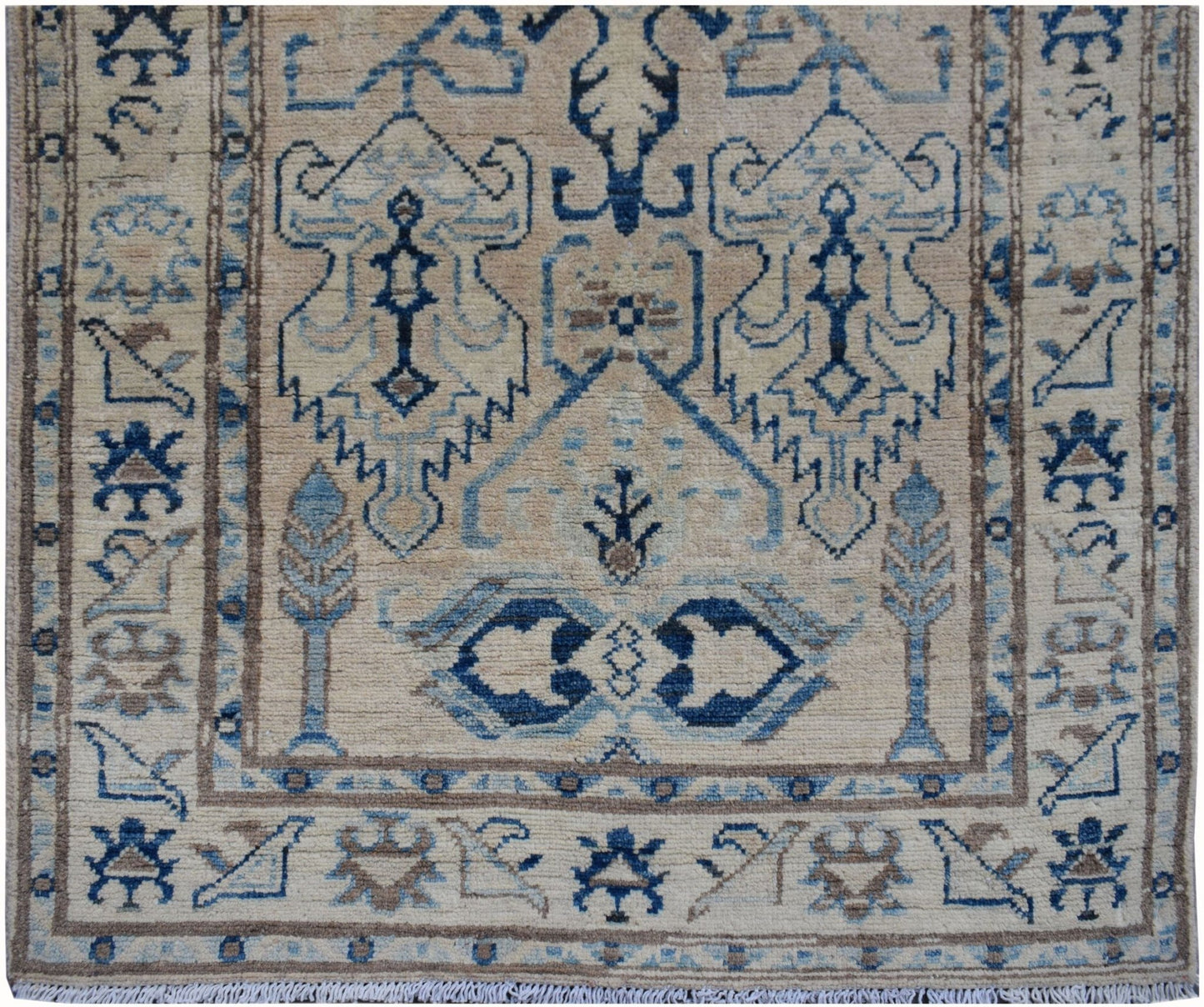 Handmade Afghan Kazakh runner rug featuring a beige field with blue and grey geometric patterns.