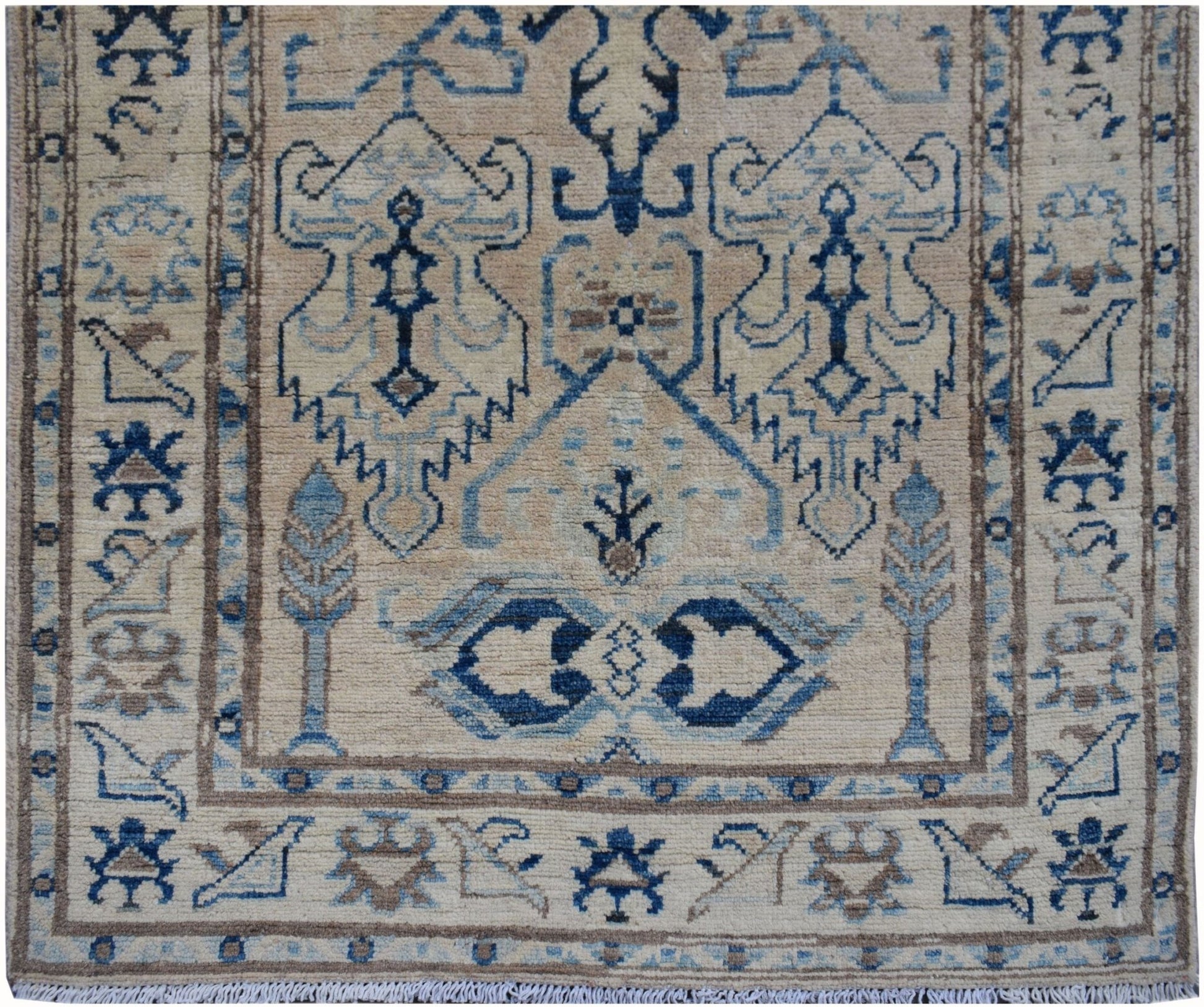 Handmade Afghan Kazakh runner rug featuring a beige field with blue and grey geometric patterns.
