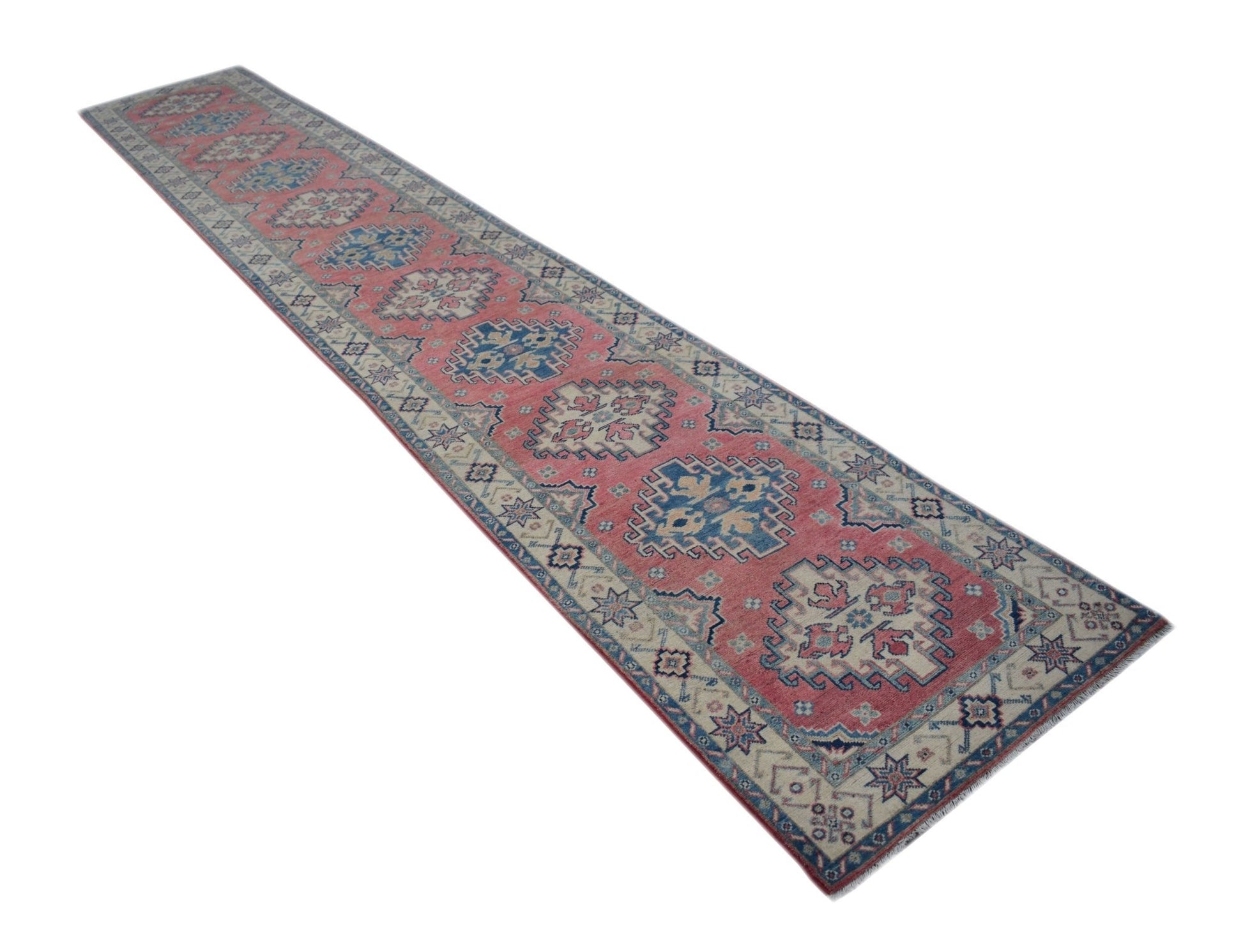 A handmade Afghan Kazakh runner rug featuring traditional geometric motifs in red, blue, and cream.