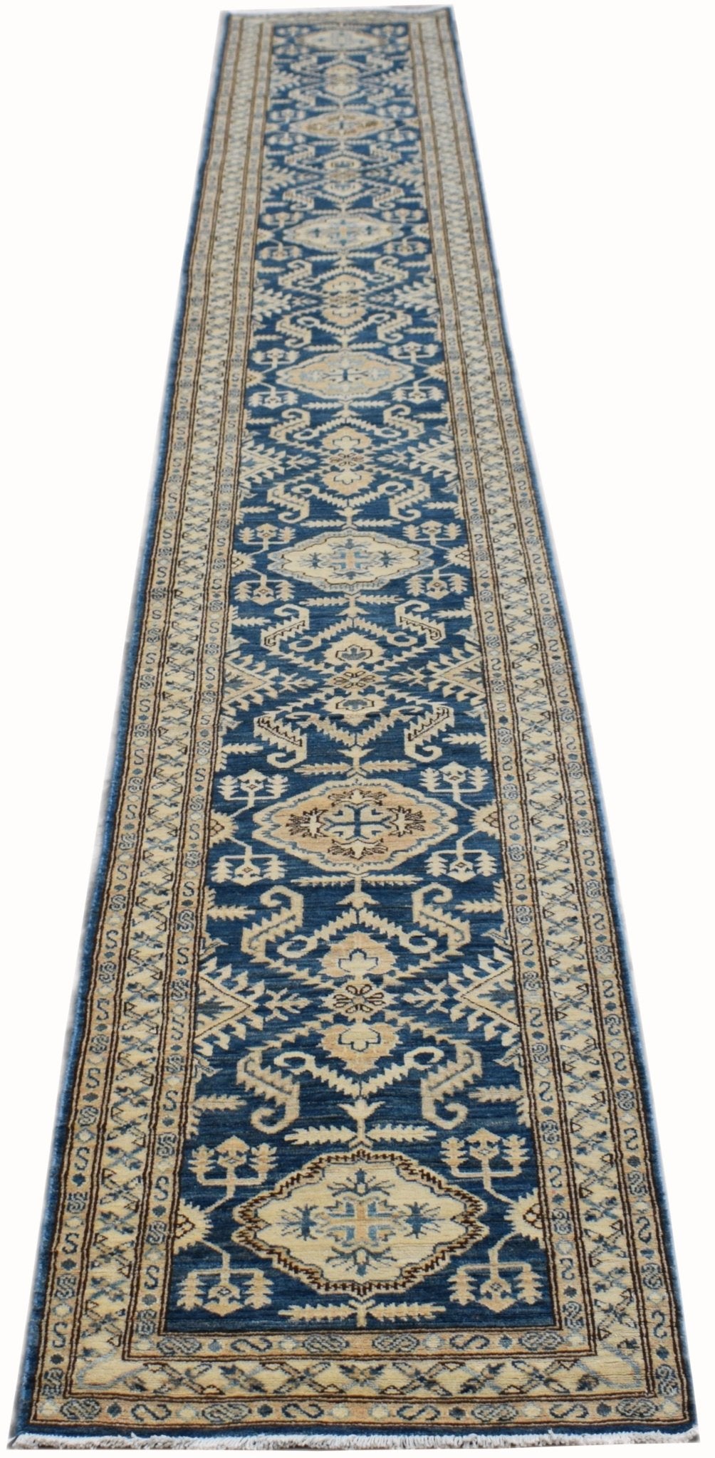 Handmade Afghan Kazakh runner rug featuring a repeating geometric pattern in blue and beige.