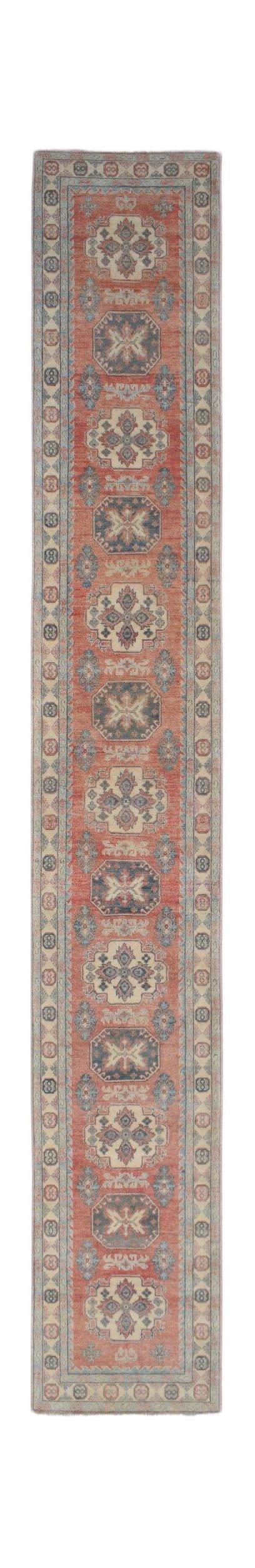 A handmade Afghan Kazakh runner rug featuring traditional geometric motifs in red, blue, and cream.