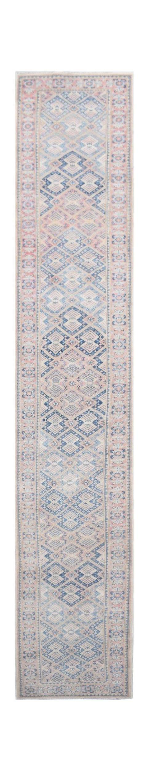 Handmade Afghan Kazakh runner rug featuring a geometric diamond pattern in blue and beige tones.