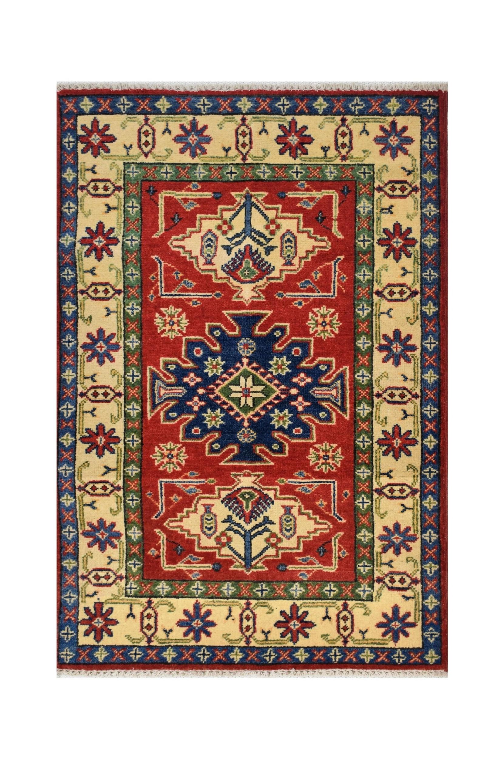 Handmade Afghan Kazakh rug featuring a central blue medallion on a red field with floral motifs.