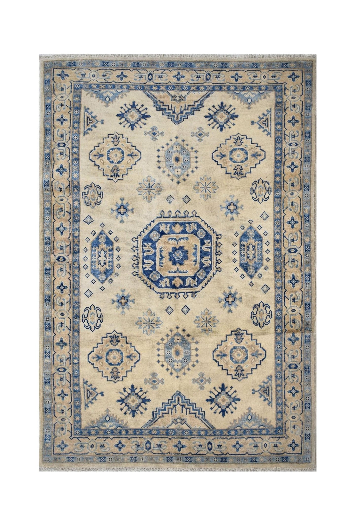Handmade Afghan Kazakh rug featuring a traditional blue and beige geometric pattern.
