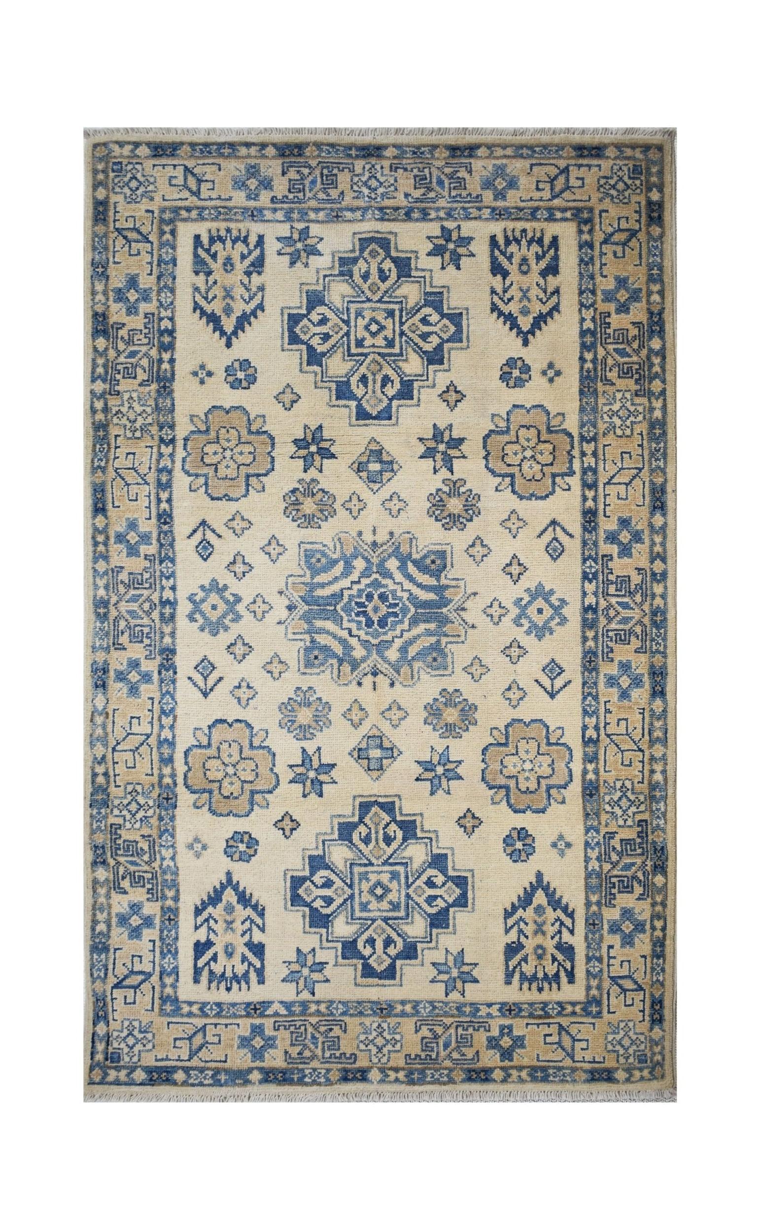 Handmade Afghan Kazakh wool rug featuring a traditional blue and beige geometric pattern.