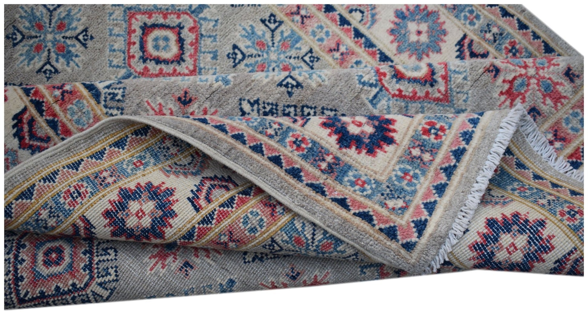 A handmade Afghan Kazakh rug featuring traditional geometric motifs in blue, red, and cream tones.