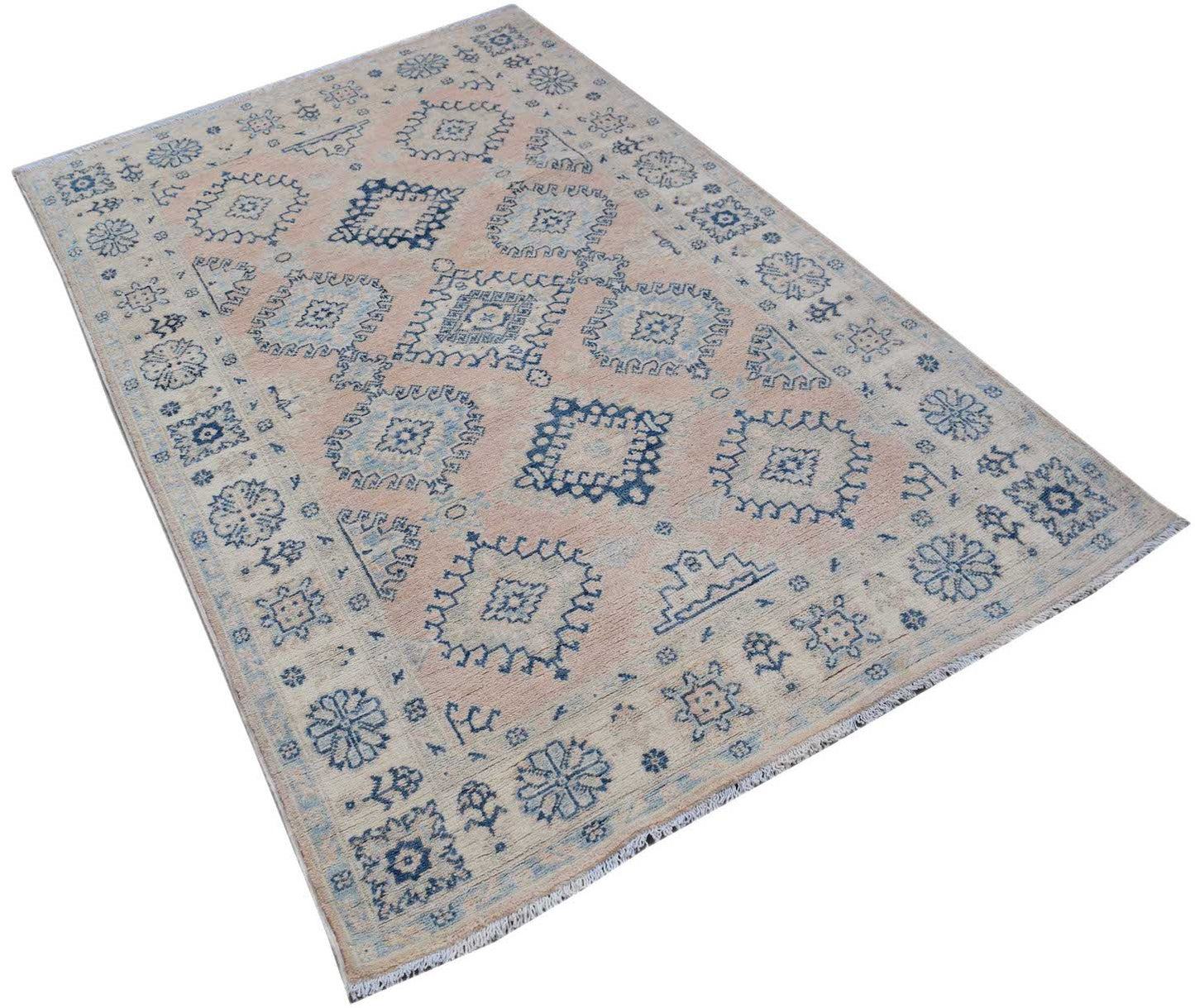 A handmade Afghan Kazakh rug featuring traditional blue geometric patterns on a light beige field.