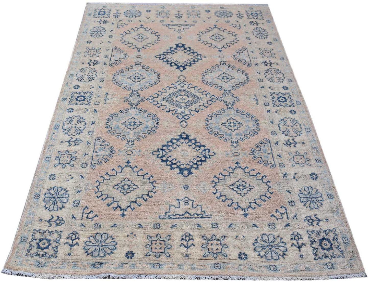 Handmade Afghan Kazakh rug featuring blue geometric and floral motifs on a light beige background.