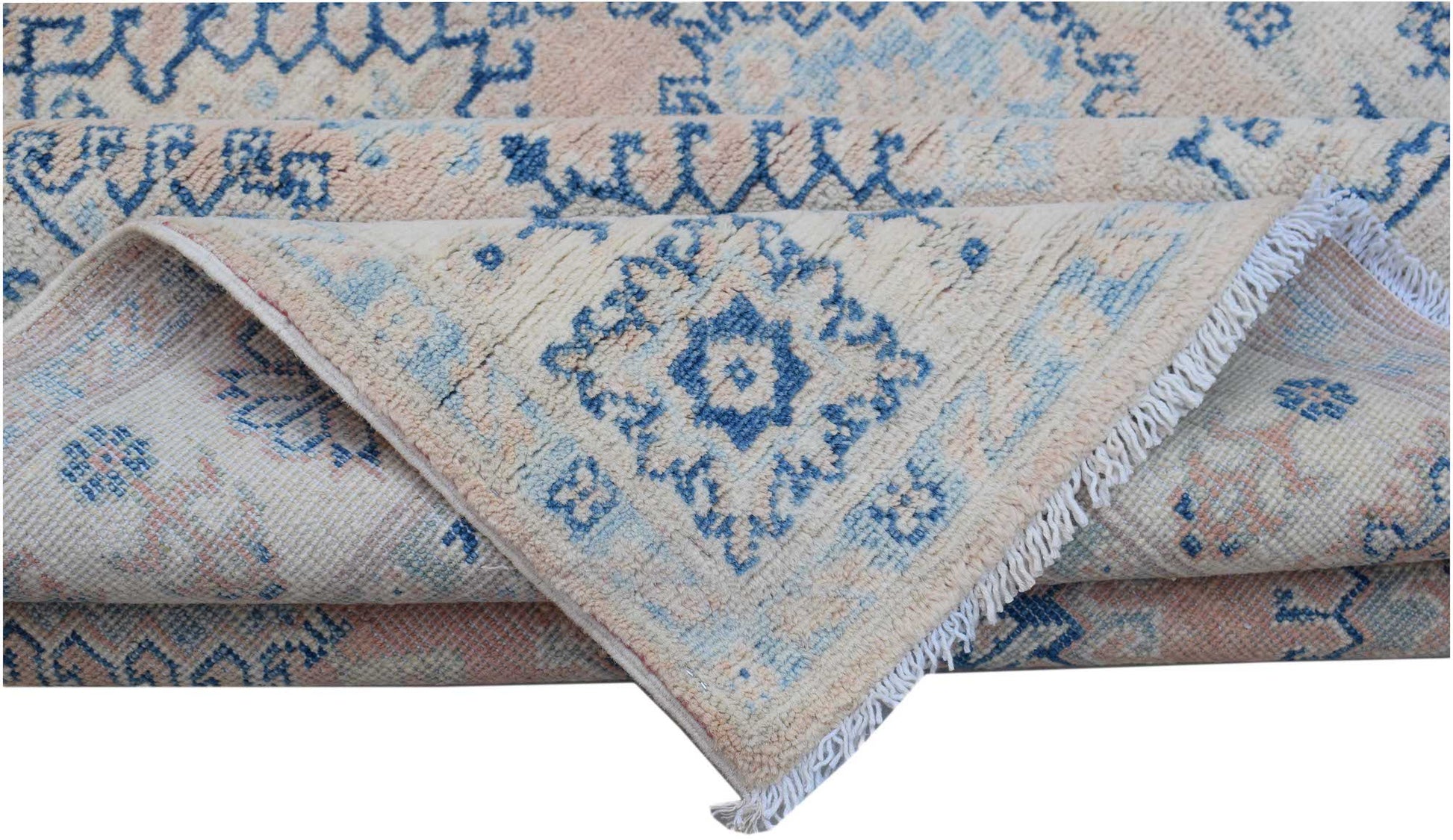 A handmade Afghan Kazakh rug featuring a traditional blue and cream geometric pattern.