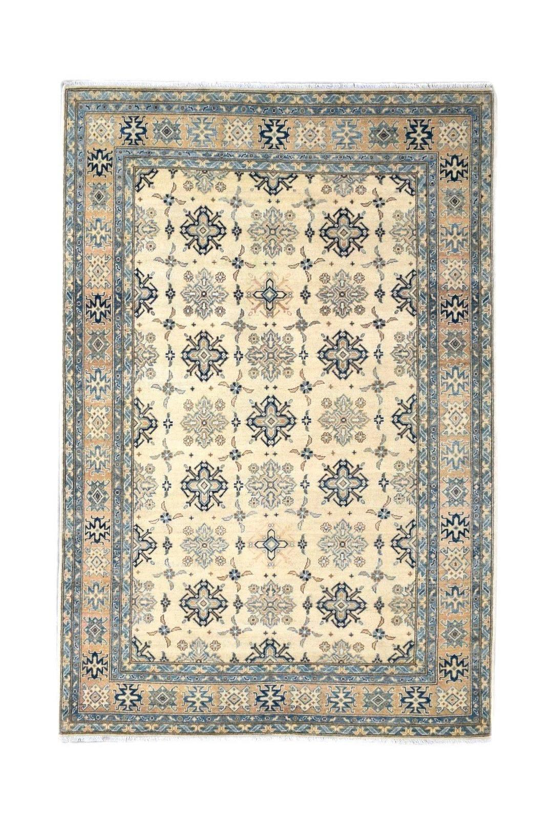 Handmade Afghan Kazakh rug featuring a beige field with blue and grey geometric floral motifs.