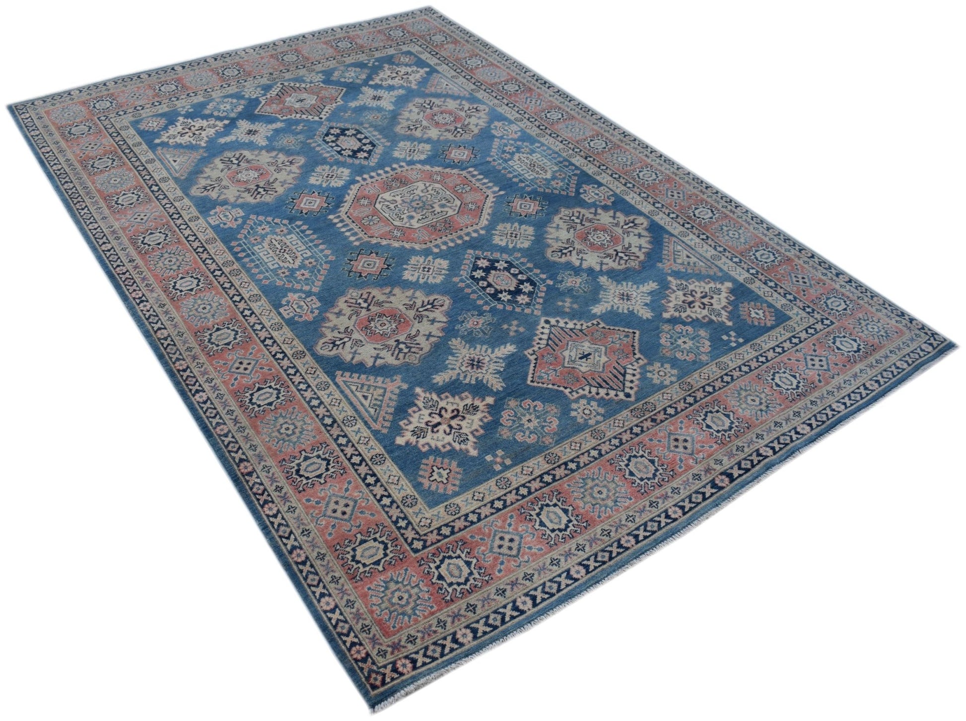 A handmade Afghan Kazakh rug featuring traditional geometric motifs in blue, pink, and cream.