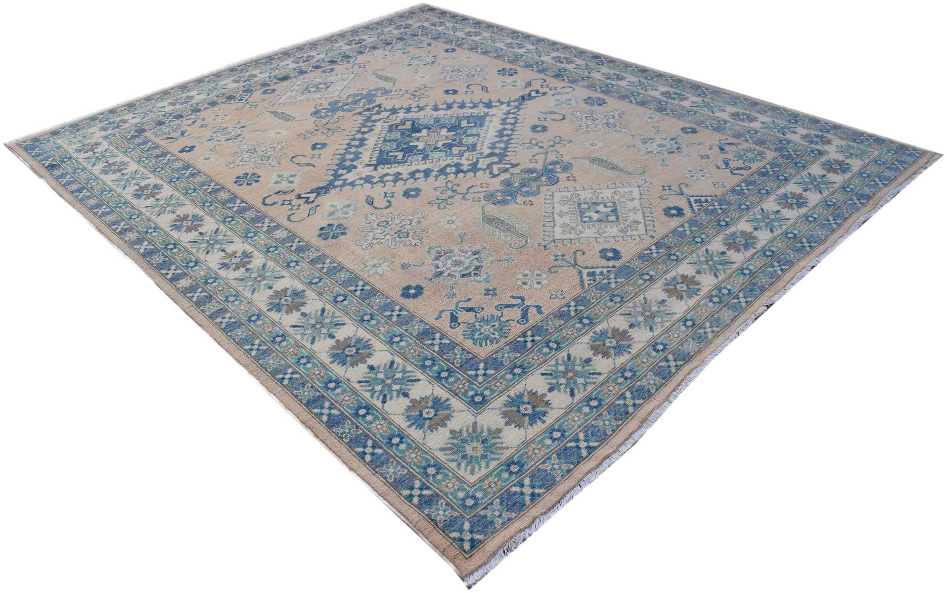 A handmade Afghan Kazakh rug featuring a beige field with blue and grey geometric patterns.