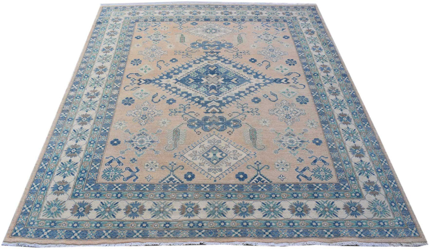 Handmade Afghan Kazakh rug featuring a beige field with blue and grey geometric patterns.