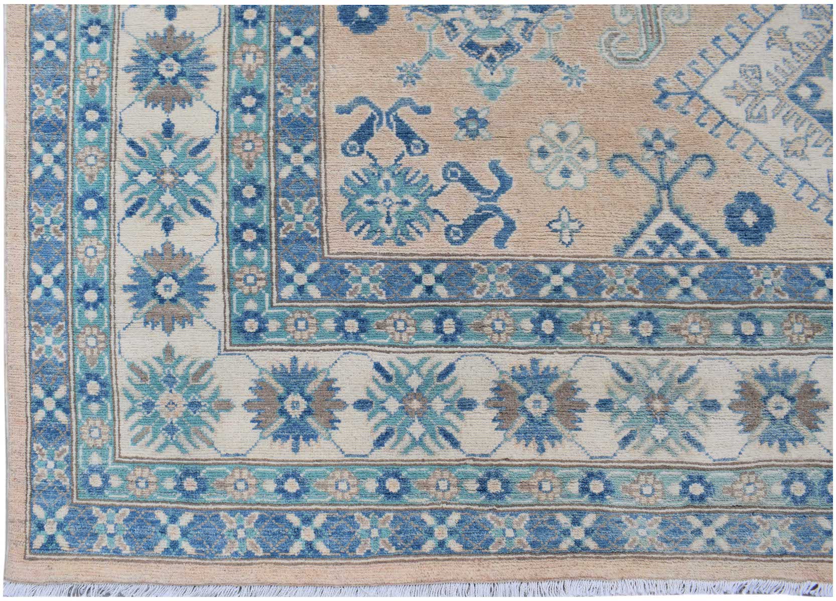Handmade Afghan Kazakh rug featuring a beige field with blue and grey geometric floral patterns.