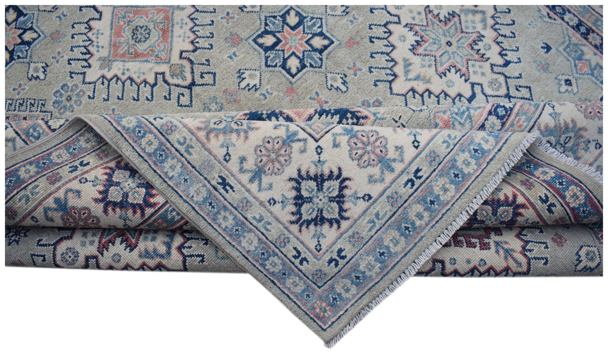 Handmade Afghan Kazakh rug featuring traditional geometric motifs in blue, pink, and cream wool.