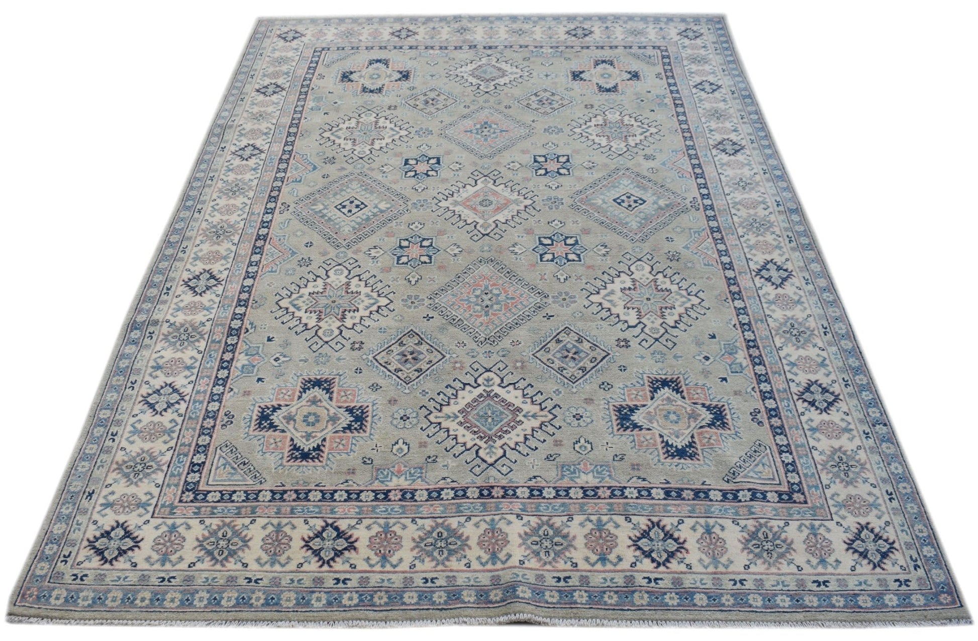 Handmade Afghan Kazakh rug featuring traditional geometric motifs in blue, pink, and beige tones.