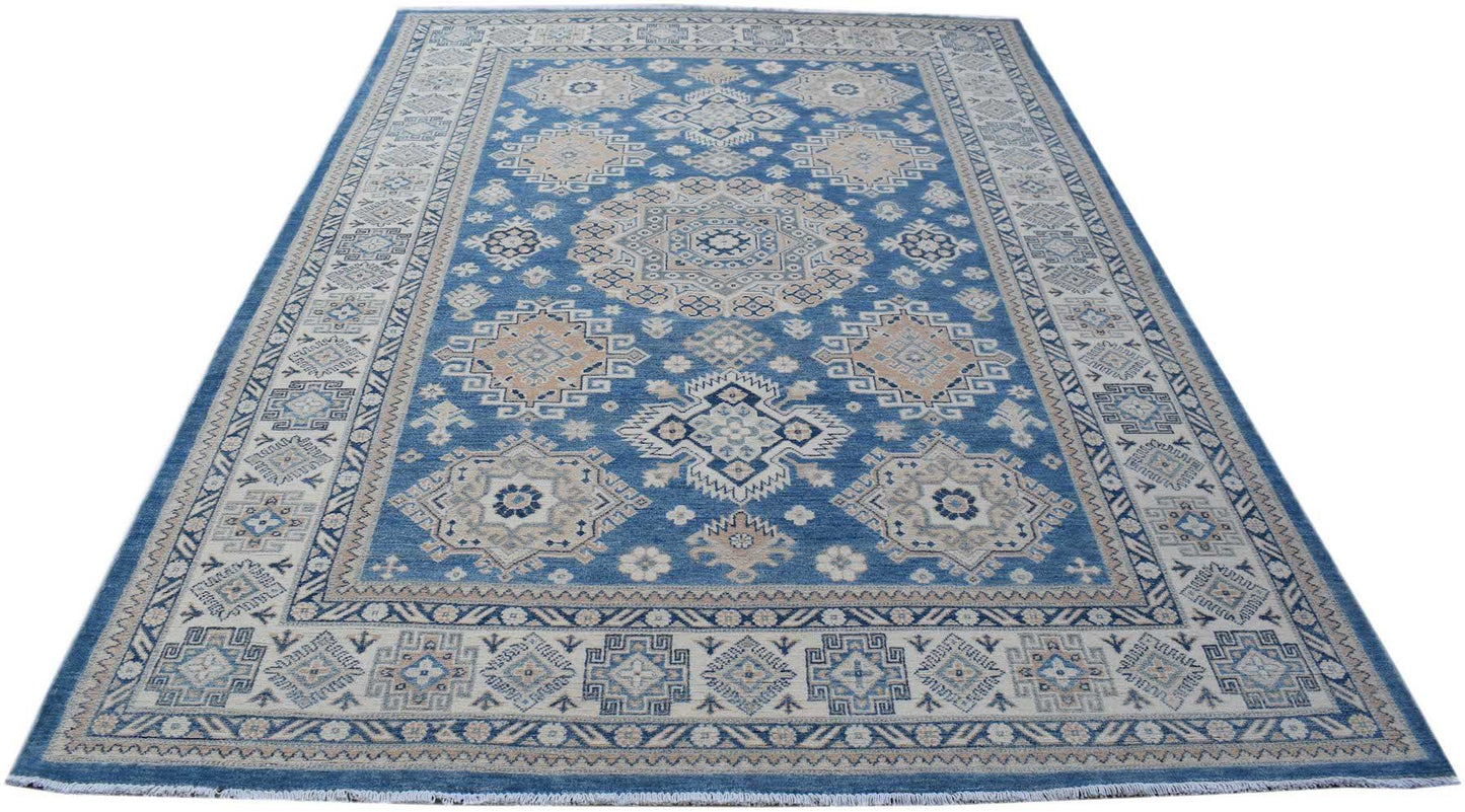 Handmade Afghan Kazakh rug featuring a geometric pattern in shades of blue, beige, and grey.