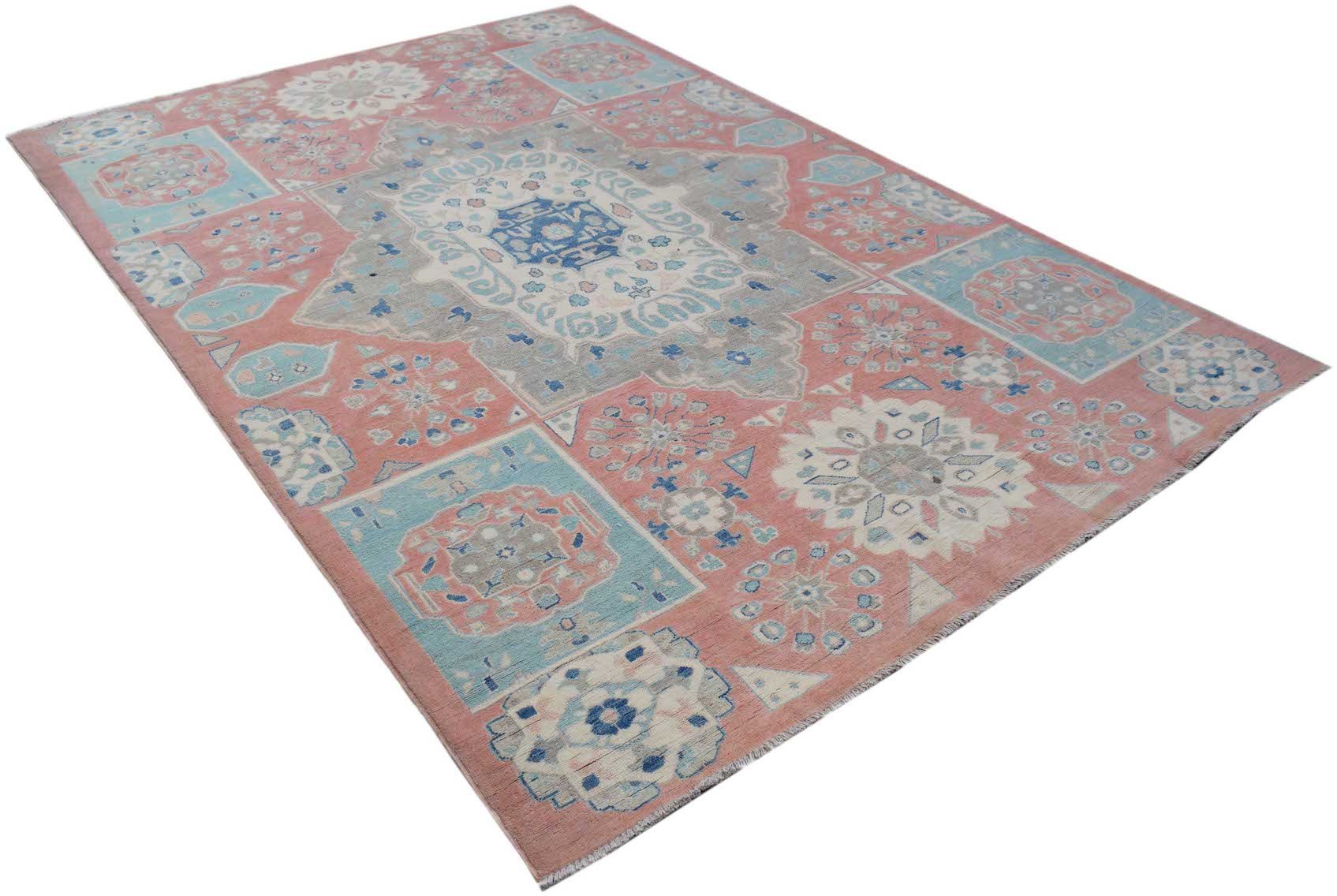 Handmade Afghan Kazakh rug featuring a geometric floral pattern in shades of pink, blue, and grey.