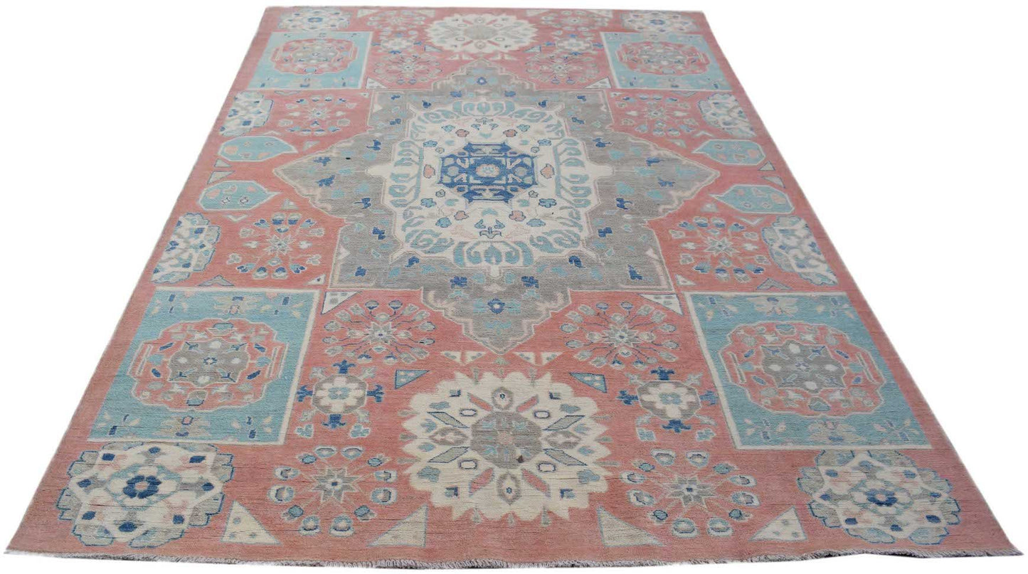 Handmade Afghan Kazakh rug featuring traditional geometric motifs in shades of pink, blue, and grey.