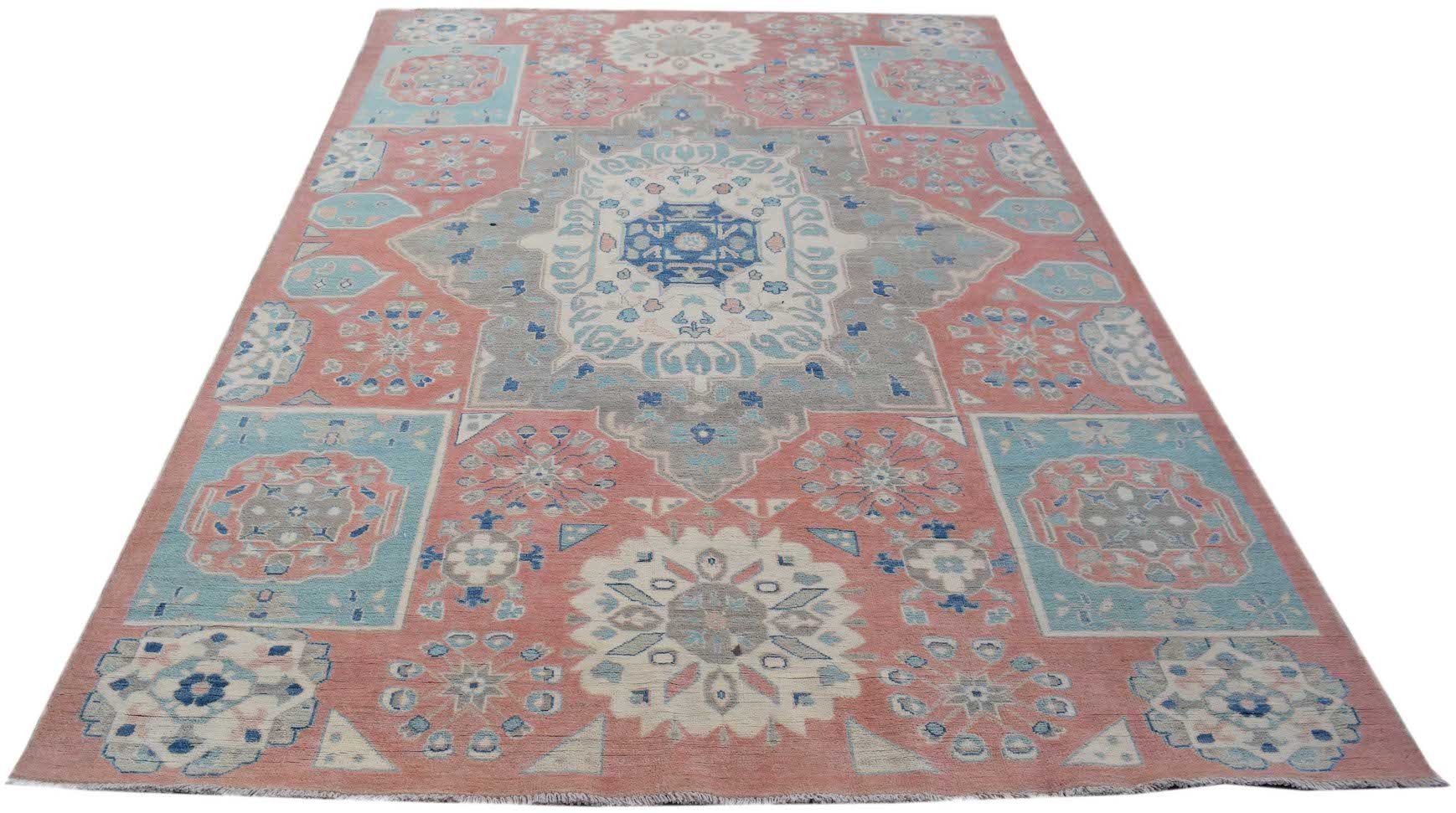 Handmade Afghan Kazakh rug featuring traditional geometric motifs in shades of pink, blue, and grey.