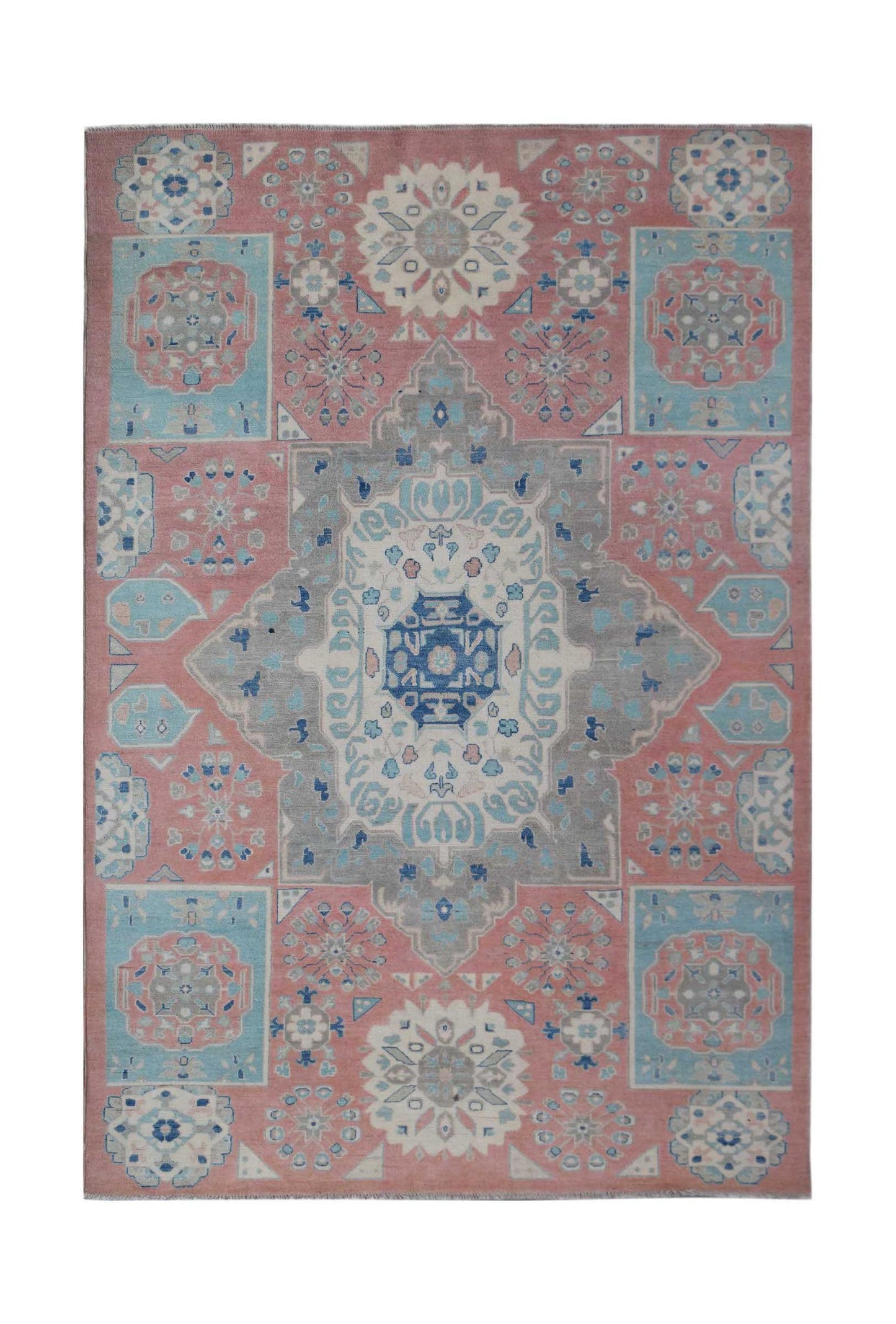 Handmade Afghan Kazakh rug featuring a geometric medallion pattern in pink, blue, and grey tones.