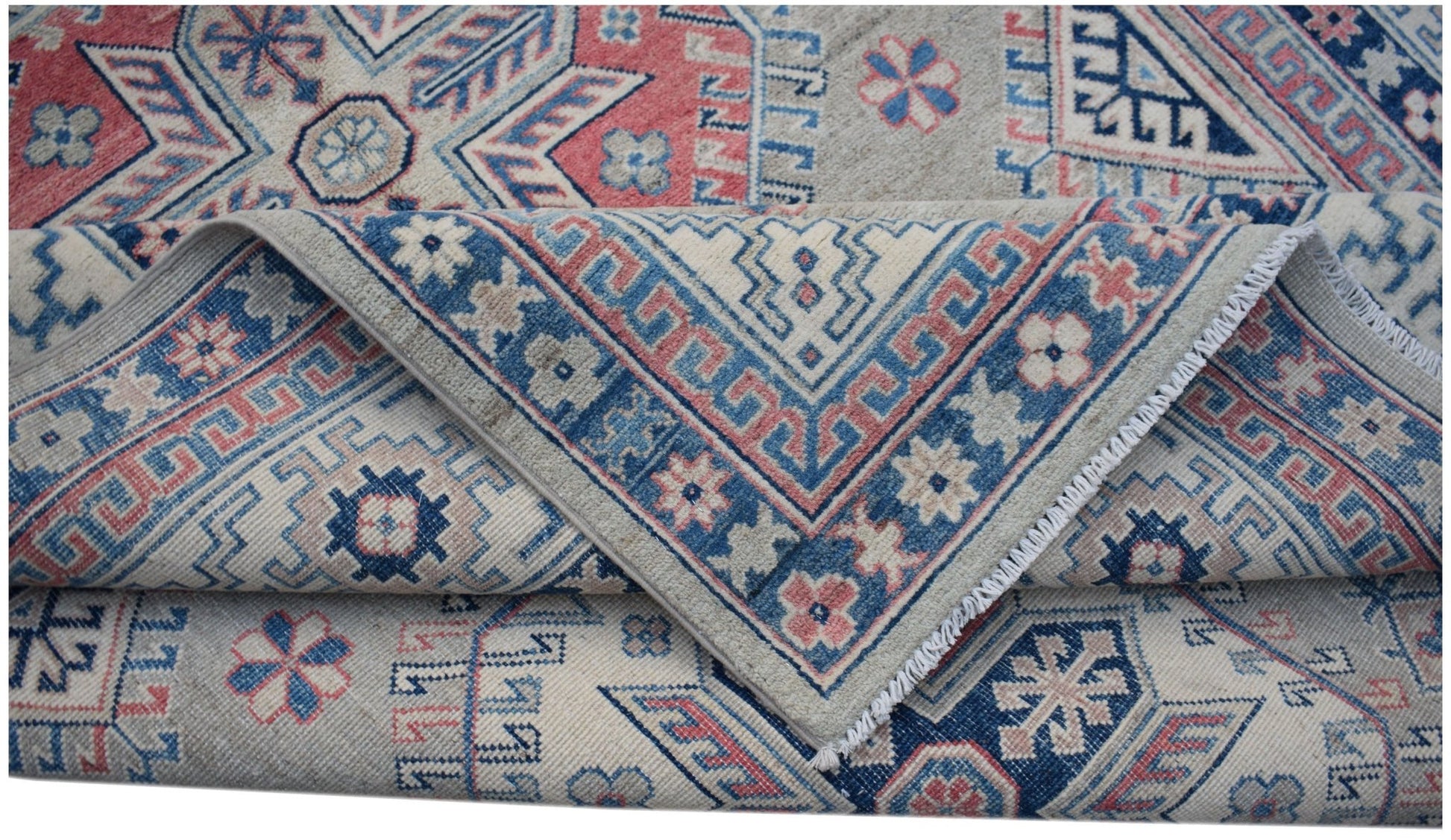 A handmade Afghan Kazakh rug featuring traditional geometric motifs in blue, red, and beige wool.