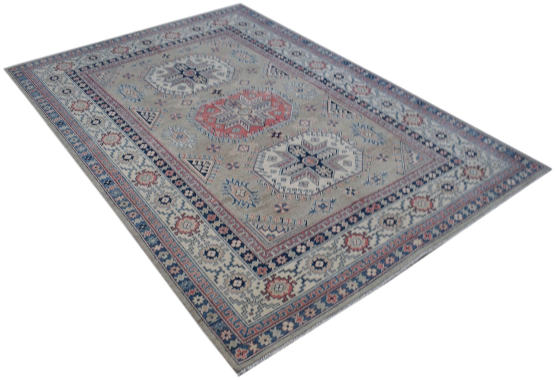 Handmade Afghan Kazakh rug featuring traditional geometric motifs in blue, red, and beige tones.