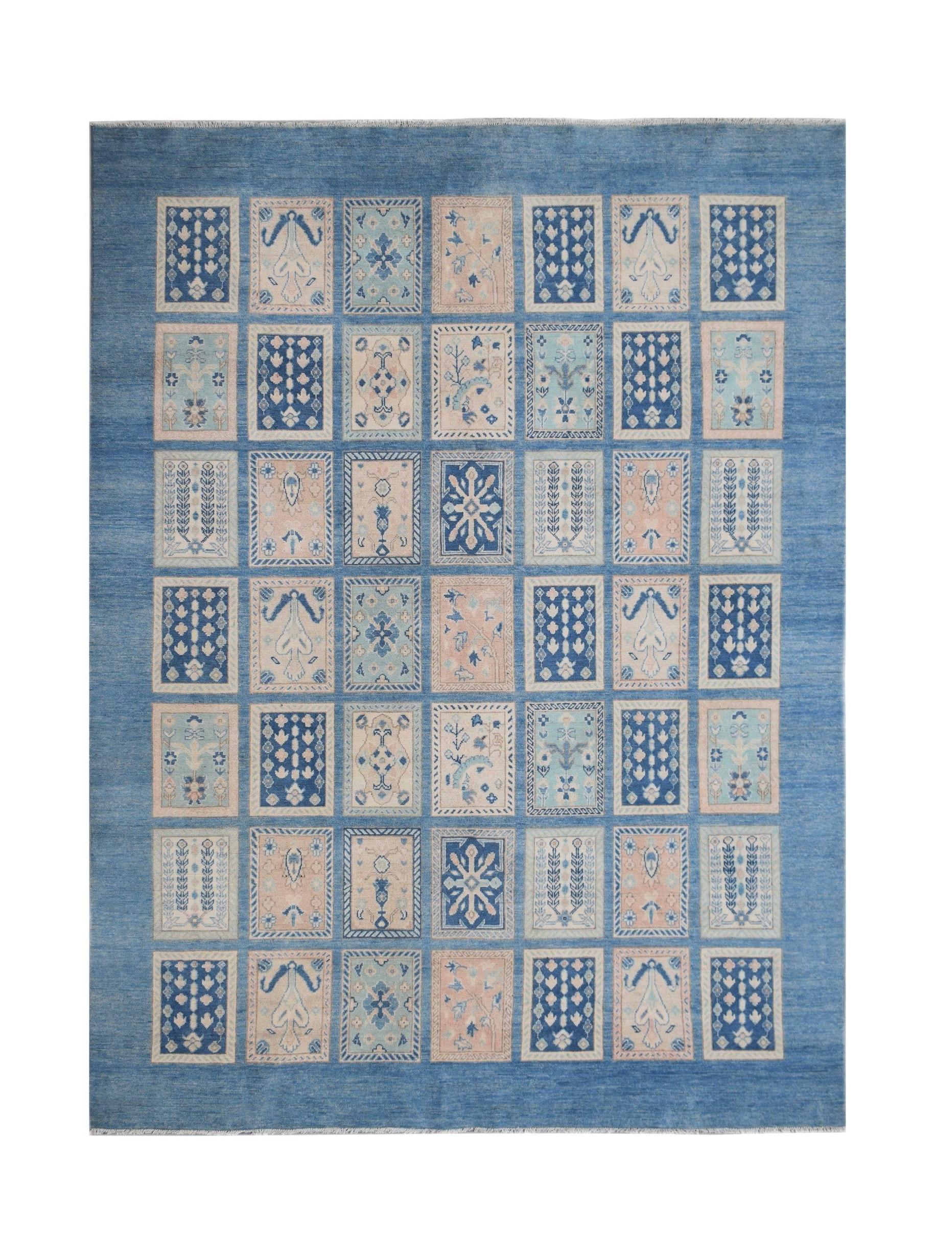 Handmade Afghan Kazakh rug featuring a grid of rectangular motifs in shades of blue and beige.