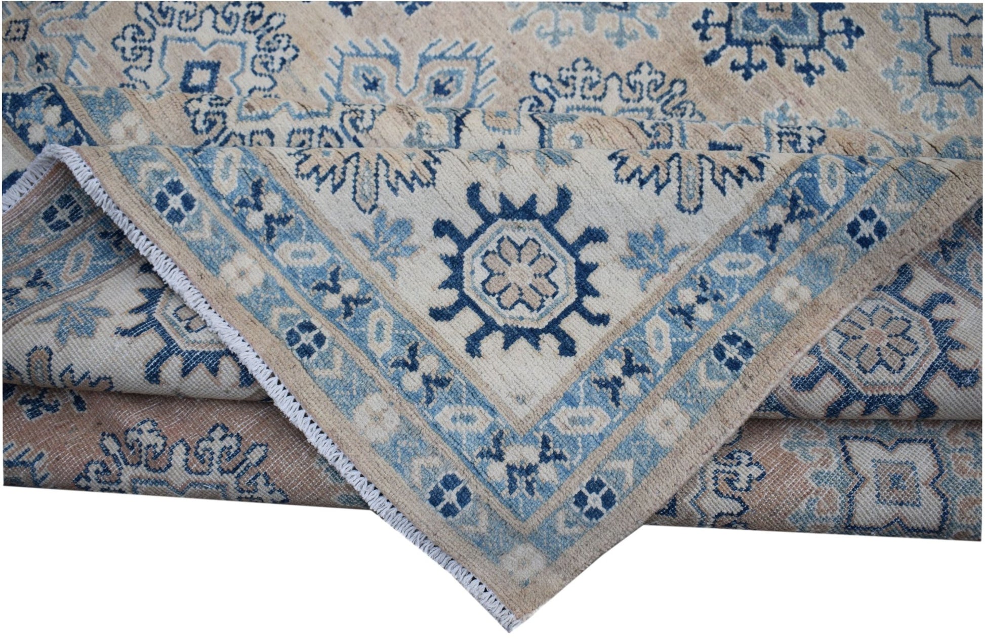A handmade Afghan Kazakh rug featuring traditional blue and beige geometric patterns.