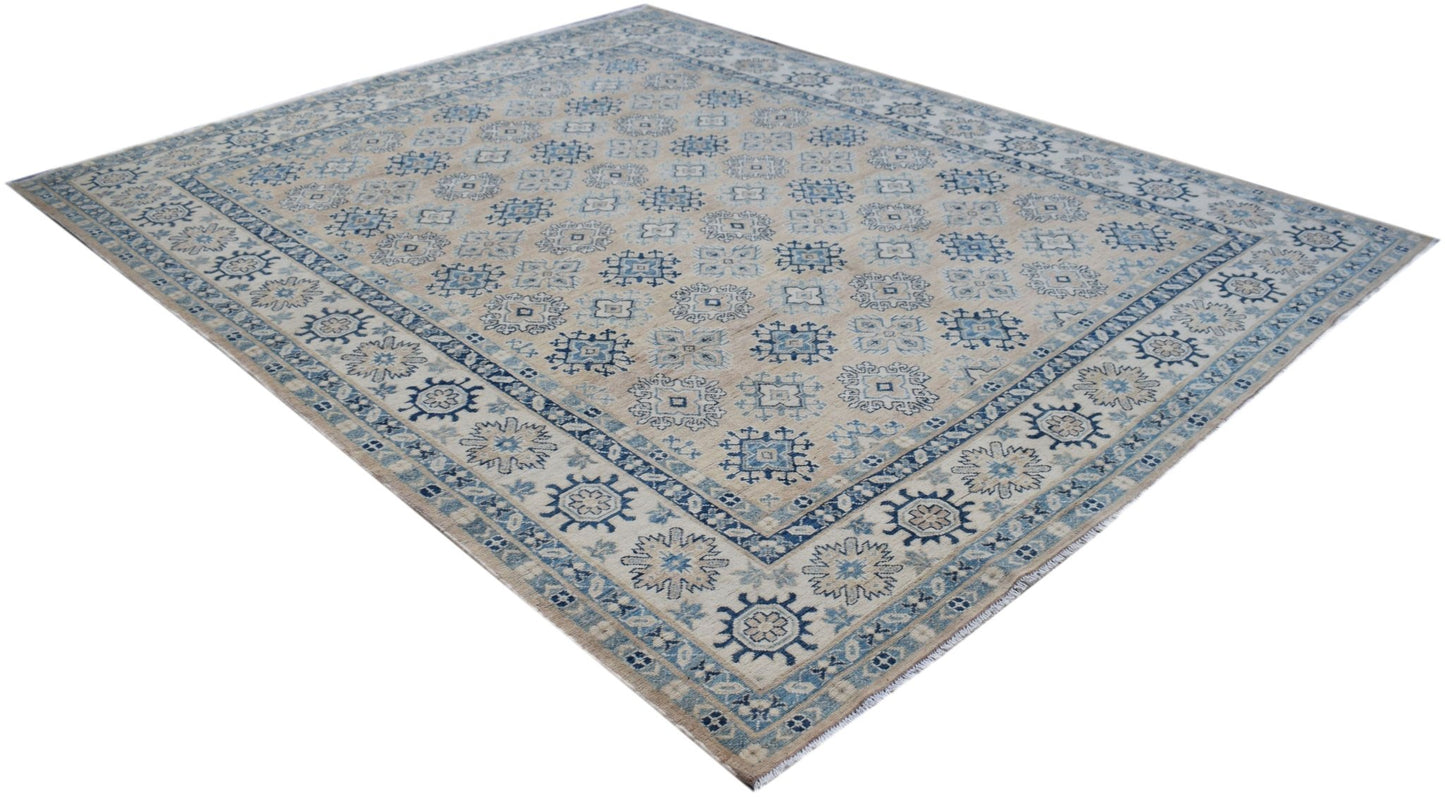 A handmade Afghan Kazakh rug featuring a traditional blue and beige geometric pattern.