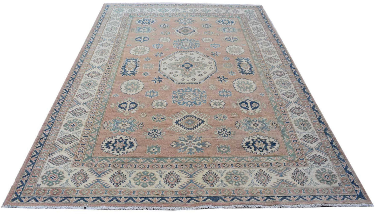 Handmade Afghan Kazakh rug featuring traditional geometric motifs in blue and cream on a tan field.