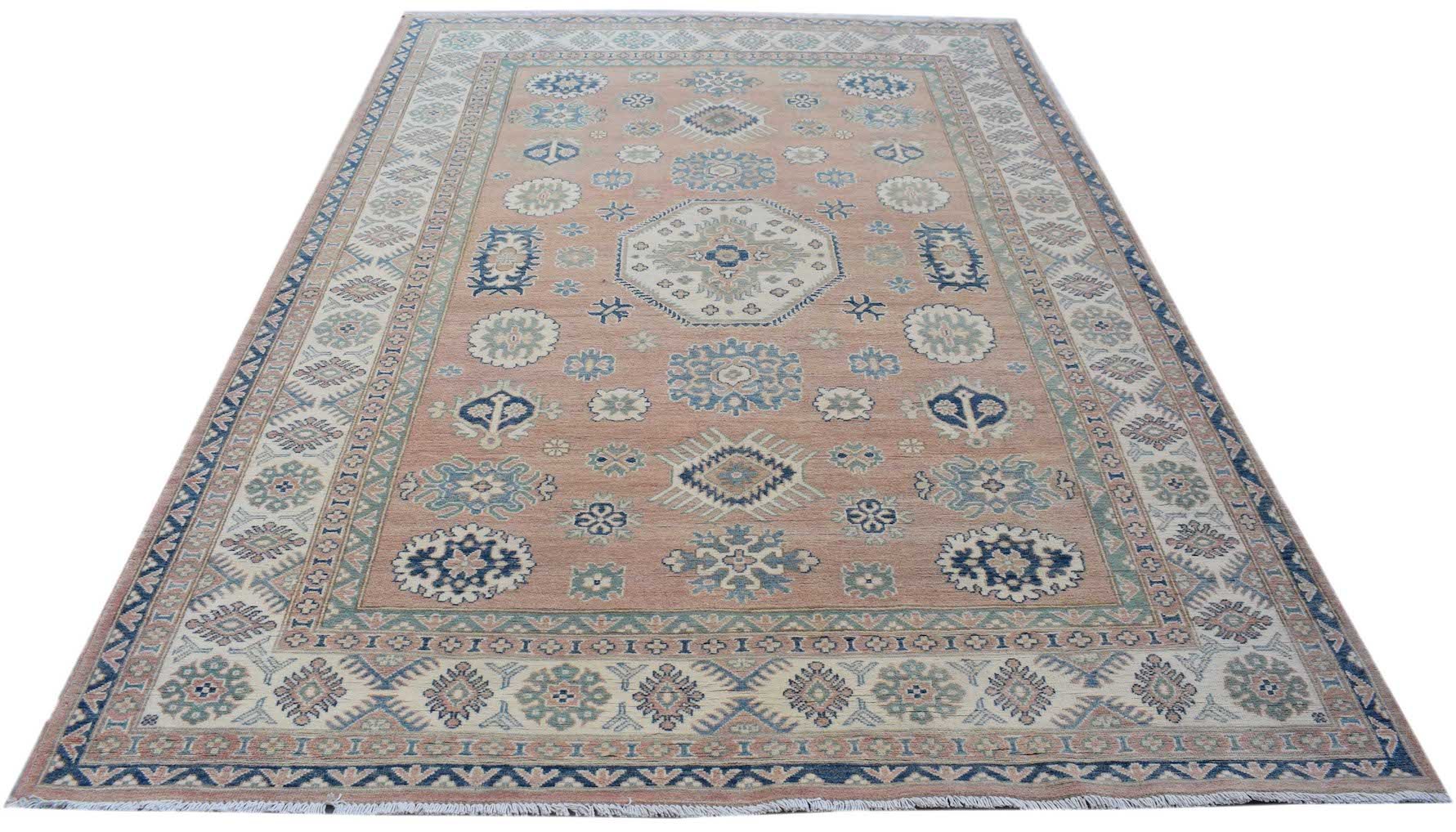 Handmade Afghan Kazakh rug featuring traditional geometric motifs in blue and cream on a tan field.