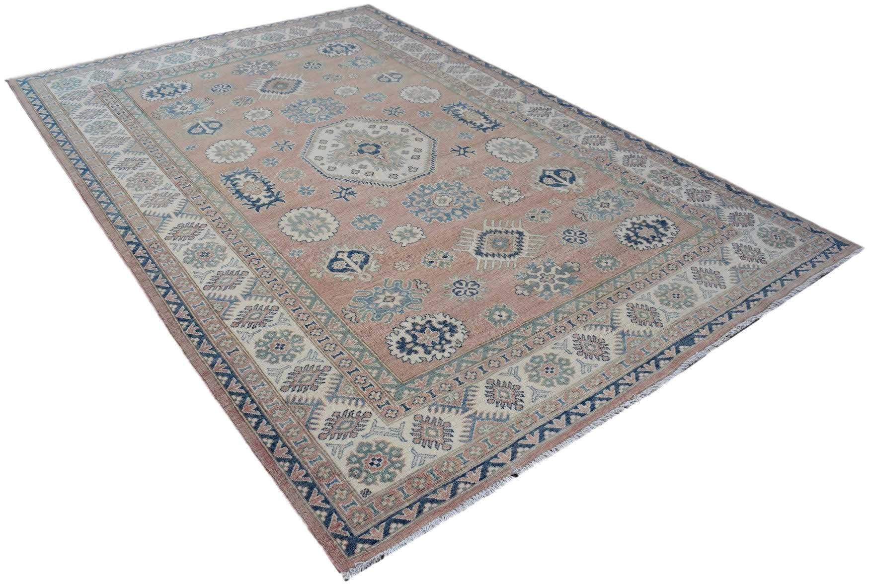 Handmade Afghan Kazakh rug featuring traditional geometric motifs in blue and cream on a pink field.