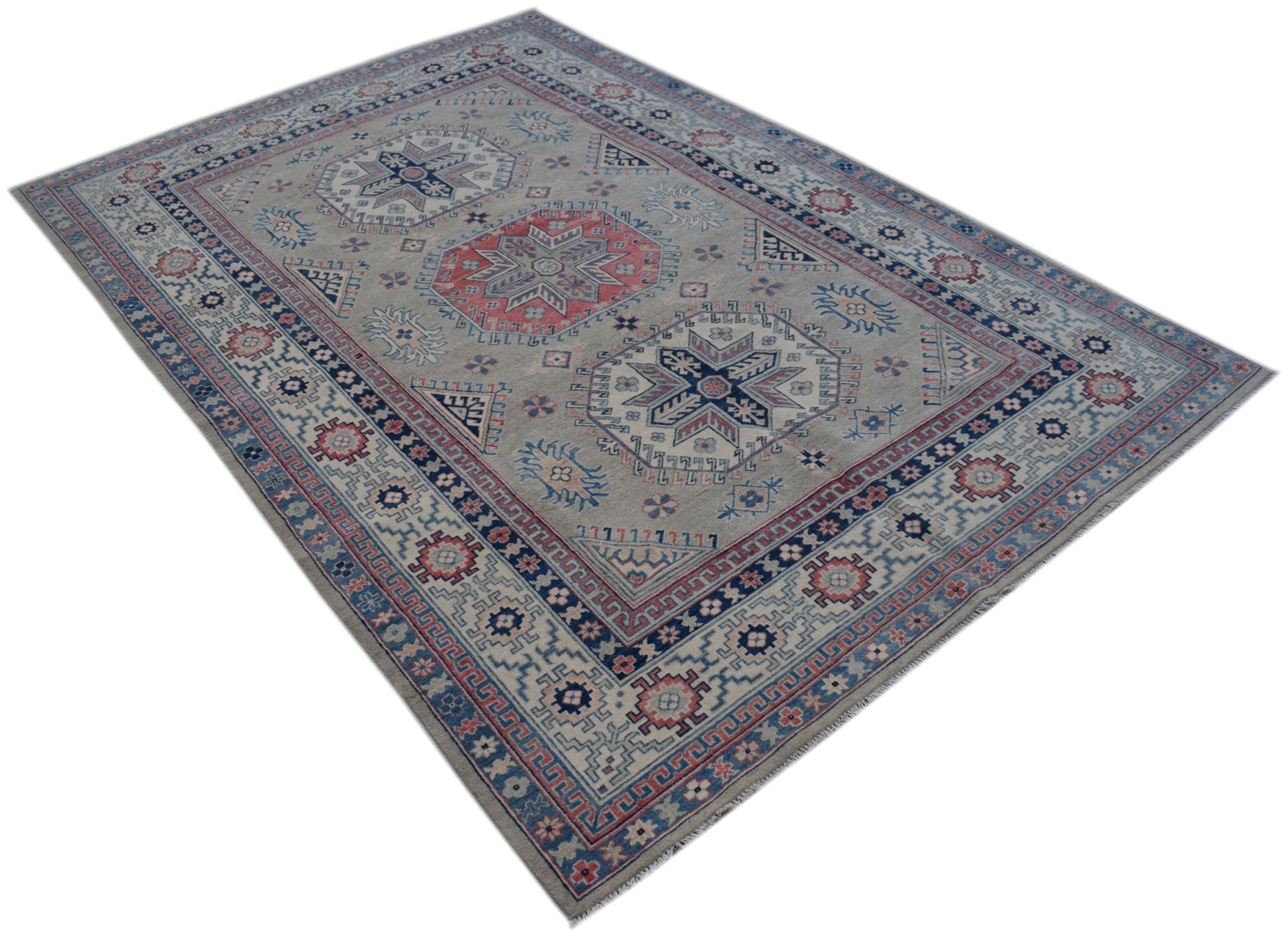 Handmade Afghan Kazakh rug featuring traditional geometric motifs in blue, red, and grey tones.