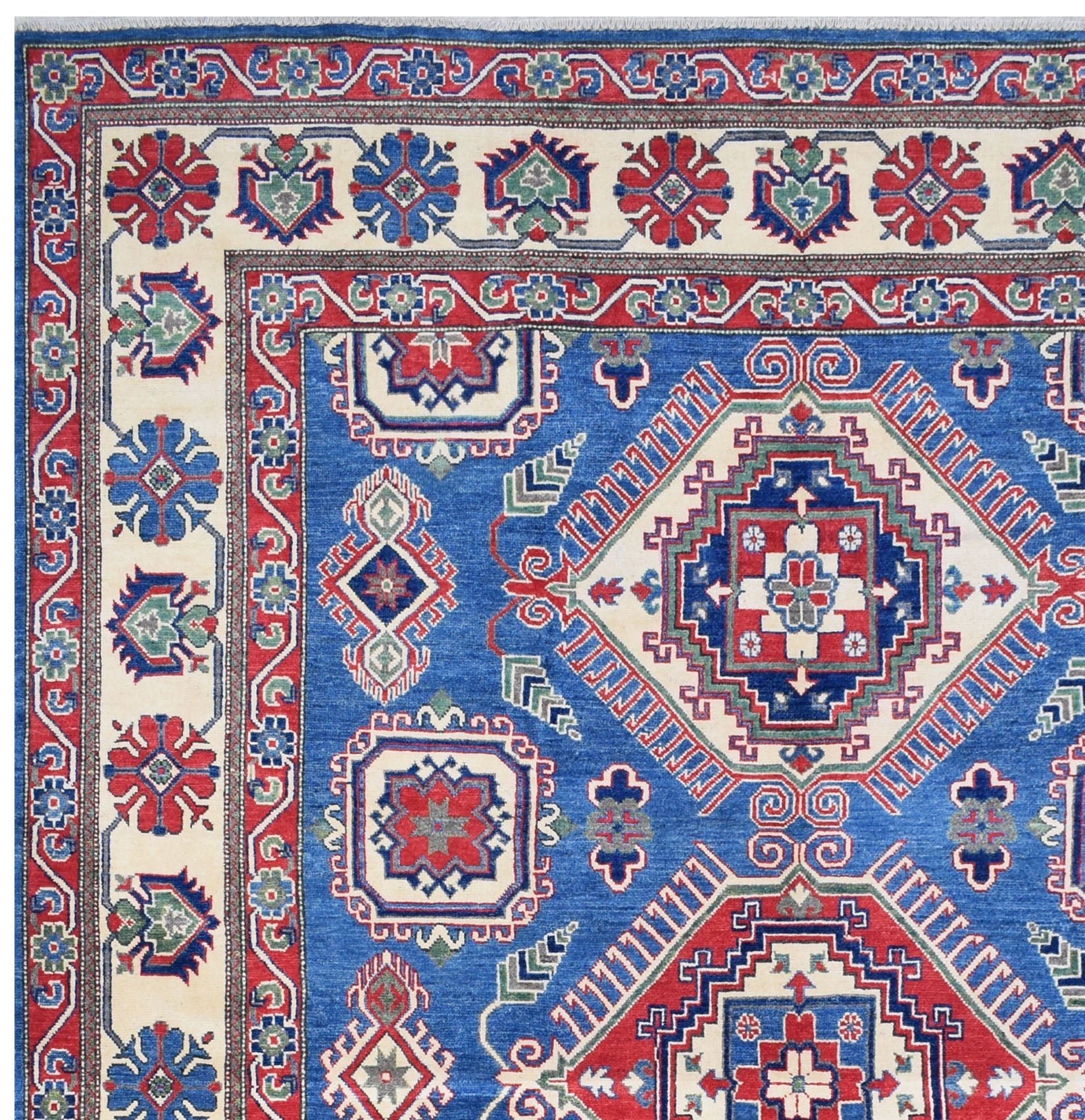 Handmade Afghan Kazakh rug featuring a geometric pattern in blue, red, and cream wool.