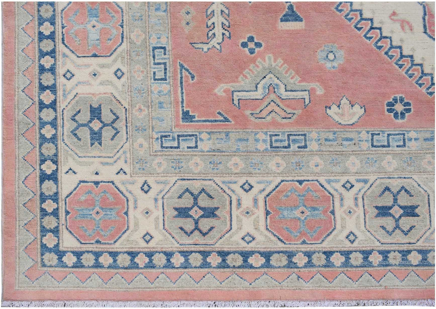 Handmade Afghan Kazakh rug featuring traditional geometric motifs in pink, blue, and cream tones.