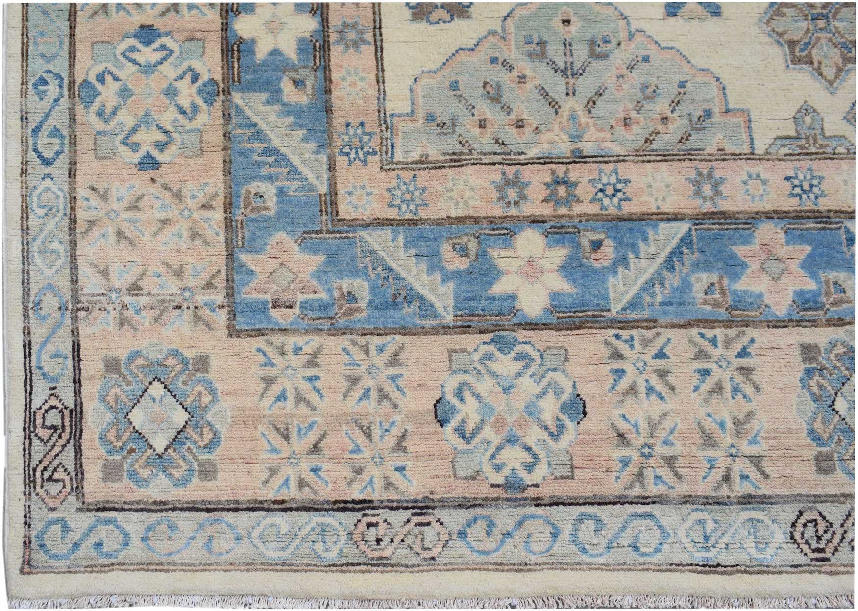Handmade Afghan Kazakh rug featuring traditional geometric patterns in blue, cream, and soft pink.