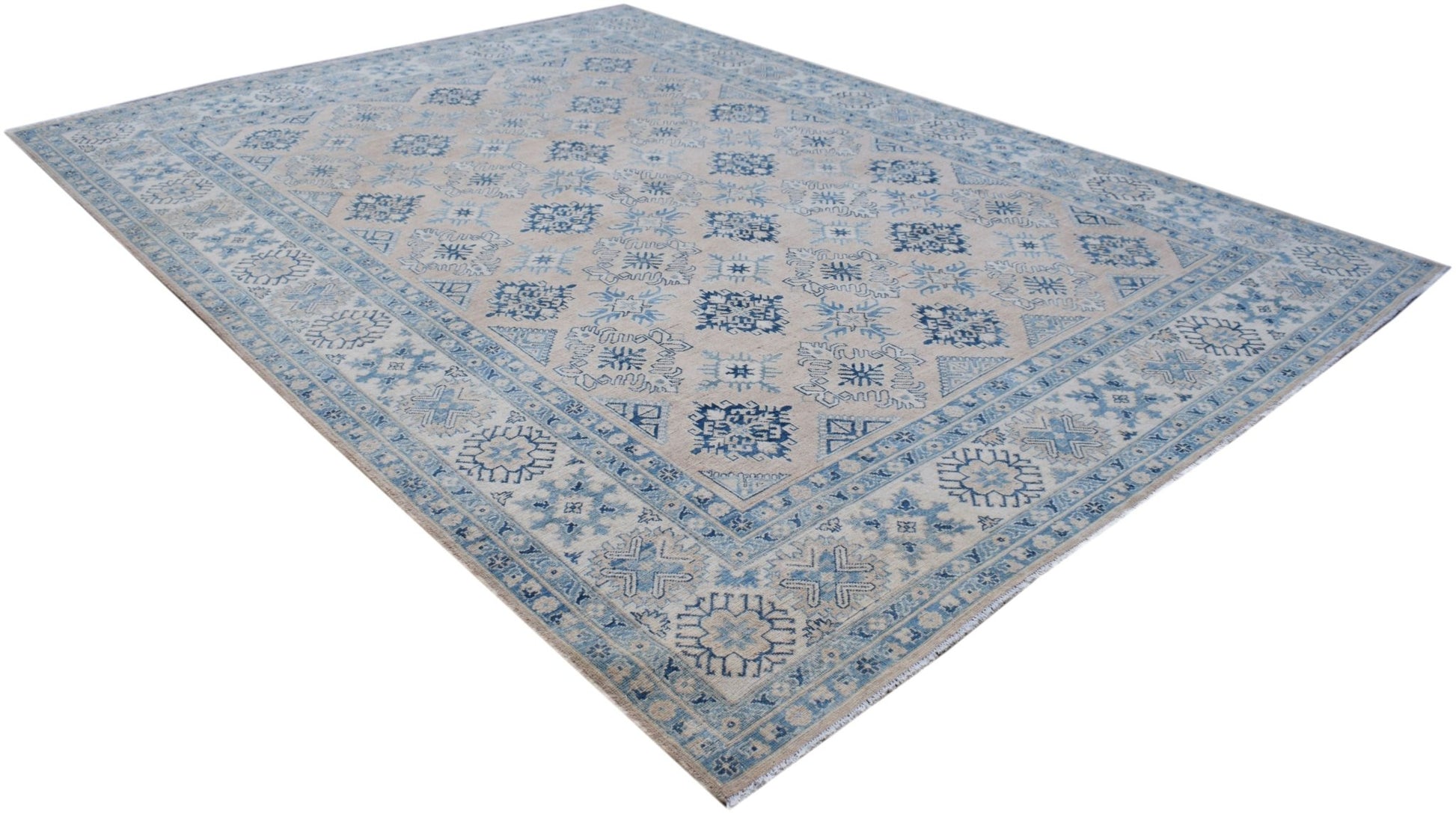 A handmade Afghan Kazakh rug featuring traditional blue geometric patterns on a beige background.