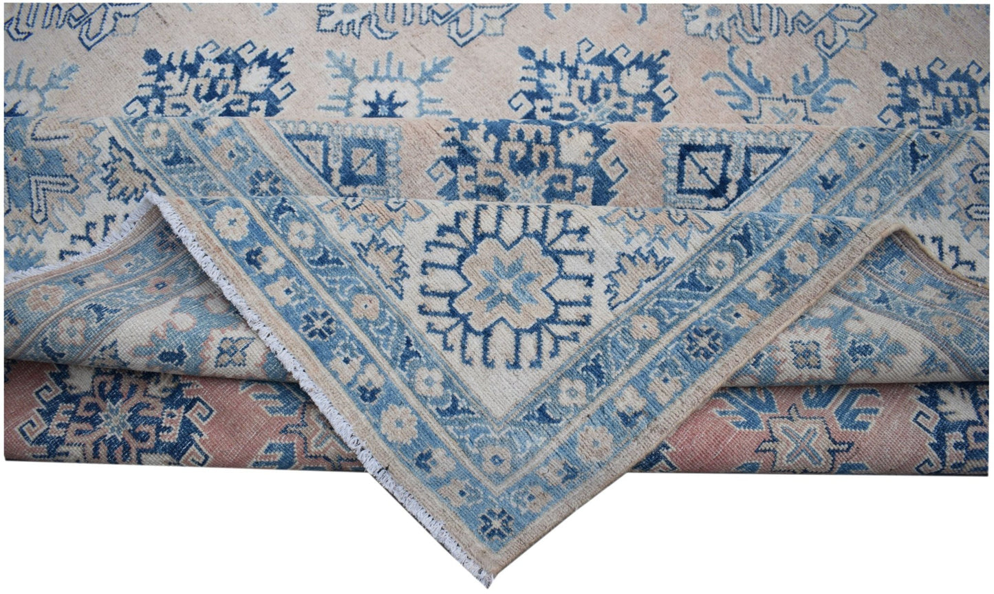 An Afghan Kazakh rug featuring traditional blue geometric patterns on a light beige wool background.