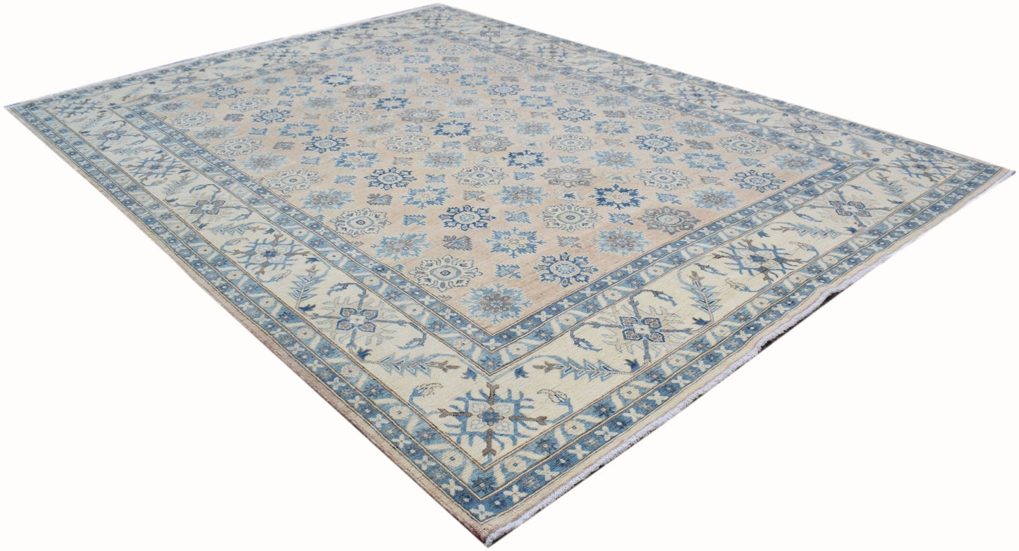 Handmade Afghan Kazakh rug featuring a traditional floral pattern in blue on a beige background.