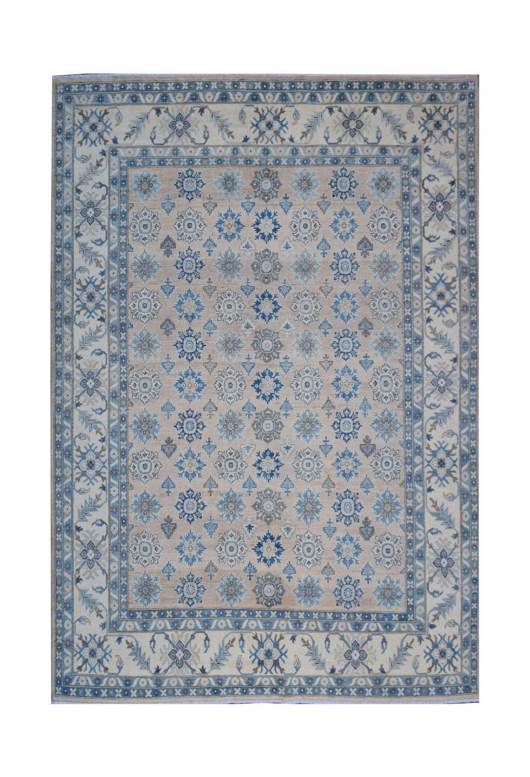 Handmade Afghan Kazakh wool rug featuring a repeating blue floral pattern on a beige background.