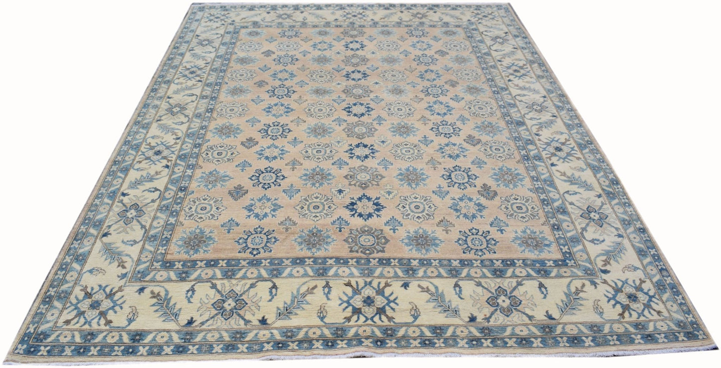 Handmade Afghan Kazakh rug featuring a repeating blue floral pattern on a light tan background.
