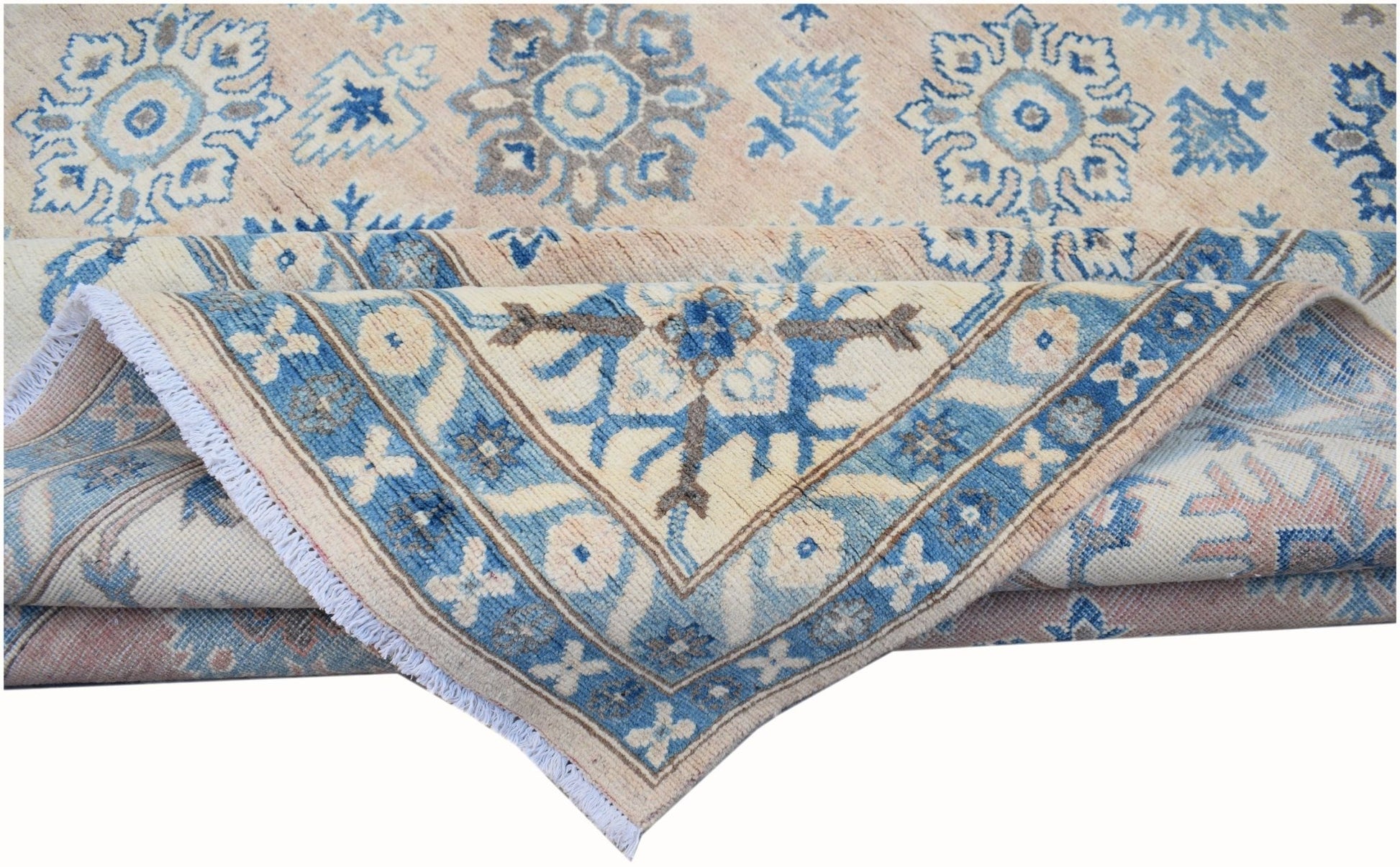 A handmade Afghan Kazakh rug featuring traditional blue and beige floral patterns.